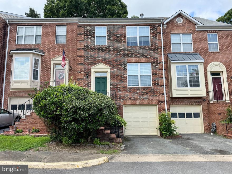 Freshly painted and new carpet, spacious 3 Level townhouse. 3 bedrooms, 3.5 bathrooms, 1-Car Garage plus one parking space, 2 woodburning fireplaces (one in the living room and a stone fireplace in the basement).  Finished walkout basement opening onto fenced back yard.  Rear deck.  Spacious master bedroom and master suite with walk in closet and soaking tub. Hardwood flooring on the main level.  Walking distance to shopping, restaurants, commuter lots.  Easy access to 95 for commuters, handy to Quantico. New washer and dryer!!