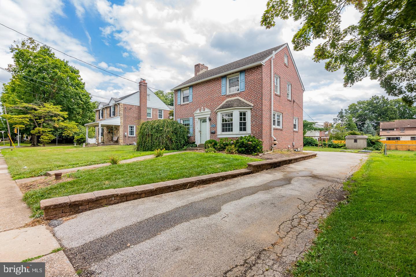 Welcome to an expanded springfield home with room aplenty !  Solid as the bricks you seem, with many new systems and a huge rear 2 story addition this 4br home.  Fresh paint, hardwood floors, bright clean kitchen and bathroom, brick living room fireplace.  This home has it all.  Enter by front or side into a welcoming space.  Classic formal dining room with bay window, large living room and a gigantic den addition provides a second entertaining or office space.  This is carried upstairs to an equally large 4th bedroom, able to be used for any other purpose you could imagine.  The basement has a french drain new electric, and gas heat and hot water both 5 years old or less.  Combined with replacement windows,, you have an efficient home.   The back yard is sunny and backs to a screen of trees.  Plenty of parking here too !   You'll be hardpressed to find a better  bargain in springfield.  Come have a look