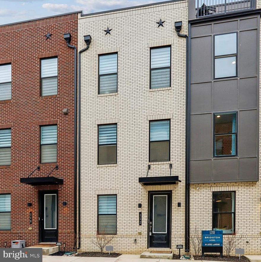 Open House Saturday 1/24 from 12-2! Incredible opportunity to move right into this modern and spacious town home at Locke Landing, in the heart of the Baltimore Peninsula’s vibrant community. Built in 2024, this 4-bedroom, 4.5-bathroom Bridgton model from DRB has TONS of upgrades ($51,000 to be exact), as well as a HUGE property tax credit that transfers to the new owners for the next 8 years! Prepare to be wowed by the open-concept luxury and modern finishes on all four levels of this thoughtfully designed home whether you enter from the main entryway or the rear, 1-car garage, both leading to a spacious Bedroom/Office/Library/Study room and convenient full bathroom. The main living area on the second level features an open, sunlit family room and dining room with an amazing chef worthy kitchen at the center of it all, with high-end appliances and an oversized quartz island. The dining room features custom built-ins and access to the rear deck. When it's time to relax, retreat to the primary suite on the third level where you’ll find oversized walk-in closets and a spa-like bathroom with dual vanity sinks and an upgraded shower. The third-level laundry room is conveniently accessible from the primary suite and secondary bedrooms. But wait, there’s more! Enjoy stunning views from the fourth level's loft deck, a private outdoor living area perfect for entertaining family and friends. The fourth level boasts another bedroom and full bathroom, PLUS a wet bar and spacious rec room. This is city living at its best, close to everything downtown, awesome restaurants, retail and shopping. Don’t miss this one!