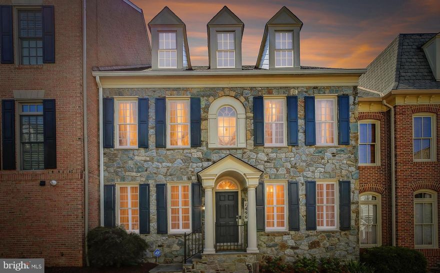 OPEN SUNDAY 2-4PM.  Welcome to 1496 Teague Drive in the charming, gated community of Evans Farm.  This highly coveted Albemarle model features over 6,000 square feet of well designed living space, an elevator, 2 car garage and more than $350,000 in quality updates and upgrades.  An exceptional stone front exterior welcomes you into this inviting home with glorious natural light, walls of windows, 10 foot ceilings, impressive architectural details and extensive millwork.  Enter into the foyer and immediately feel the warmth and elegance of this meticulously maintained home with quality finishes and gracious formal and informal spaces.  The main level features a light filled living room and a dining room that is perfect for hosting holiday dinners complete with a convenient butler's pantry for serving, that leads to an expansive chef's kitchen with gorgeous quartzite countertops, high end stainless appliances, a massive island, and a walk-in pantry.  Adjacent to the kitchen is a breakfast nook with access to the private courtyard with bubbling fountain and a cozy family room complete with  gas fireplace and built-ins.  A main level library with custom built-ins provides an excellent space for reading or work from home.  The upper levels boast 5 generously sized bedrooms including the luxurious primary suite with tray ceiling, sitting room, two walk-in closets and a renovated primary bath with heated floors, dual vanity, soaking tub and roll in shower for easy accessibility.  With plenty of room for guests, the two front bedrooms share a buddy bath, a 4th bedroom is adjacent to a hall bath and the recently renovated loft has a wonderful guest suite with designer bath.  The loft also offers options as a flex space for a second office, playroom or craft room.  The laundry is conveniently located on the bedroom level.  The lower level is an ideal leisure space for movie or game night with a custom bar complete with wine fridge, ice machine, dishwasher, and built-ins for media.  The gym with specialty flooring and an adjacent bath, plus 2 spacious storage/hobby rooms round out the lower level.  Not only is the home lovely, the 24 acre neighborhood is enchanting with a European feel, and exuding historic charm with beautiful grounds, the original Evans Farm Pond, a water mill and the community room located in the Stone House.  Enjoy a carefree, low-maintenance lifestyle with the added security of a gated community and whole house generator allowing for "lock and leave" convenience.  Fantastic location just inside the beltway with easy access to major commuter routes (495, 123 and THE GW Parkway), and only a mile to the Silver Line Metro.  Enjoy shopping and dining in nearby Tysons and downtown McLean.  The HOA covers the common grounds, roads, gate, pond, stone house and mill house, snow removal and trash.