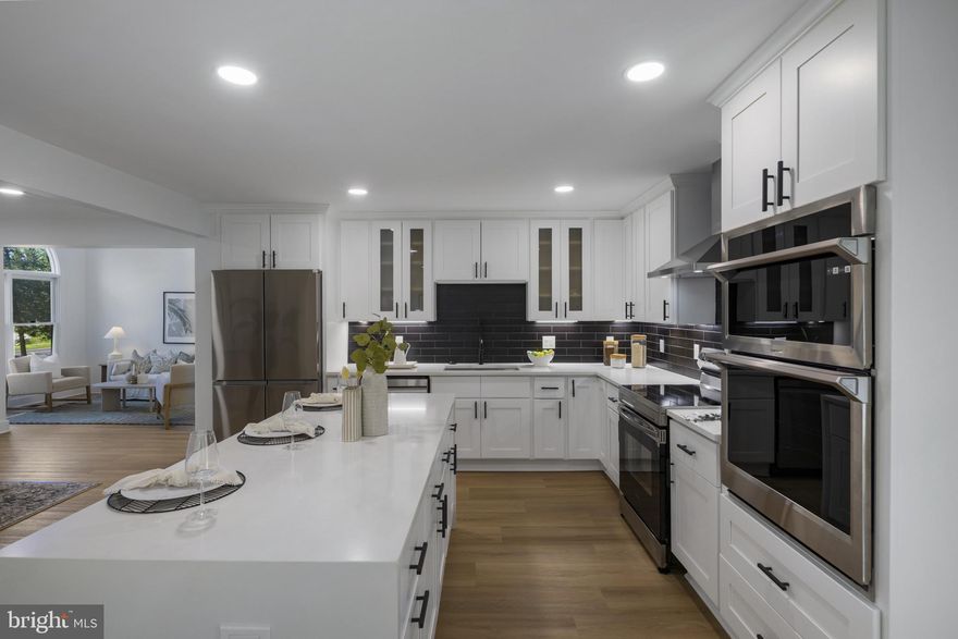 Welcome to this beautifully renovated single-family home that truly has it all! Nestled on a generous 1.4-acre lot, this spacious property has been thoughtfully updated from top to bottom with modern finishes and high-end touches throughout.

Step inside to find a stunning, brand-new kitchen featuring sleek quartz countertops, stainless steel appliances, and custom cabinetry—perfect for cooking and entertaining. Enjoy brand-new flooring and fresh paint throughout the home, adding a bright and contemporary feel to every room.

The main level boasts two separate living spaces, including one with soaring cathedral ceilings and an abundance of natural light. A cozy lounge area near the entrance provides a perfect spot to hang your coat and kick off your shoes. Also on the main level are three well-sized bedrooms, two full bathrooms, and a convenient laundry room.

Upstairs, you'll find a private primary suite complete with a full bathroom—your own peaceful retreat. The fully finished basement offers even more space with a large living area, an additional bedroom, and direct access to the backyard.

Enjoy year-round relaxation in the expansive sunroom overlooking the lush backyard. With room to roam and entertain both inside and out, this property is a rare gem.

Don't miss your chance to make this dream home yours—schedule a tour today before it's