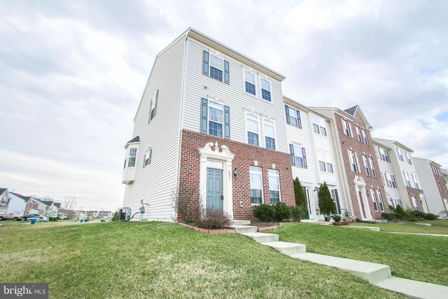 Exceptional END UNIT 3 level 3 BR 2.5 bath TH w/ large eat in kitchen & SS appliances. Kitchen leads to a great room w/ FP & half bath. The deck off the kitchen allows for ample entertaining space.  Upper level features master bedroom w/ walk-in closet, separate shower, tub, dual vanities plus 2 additional BR's & full bath. Lower level features foyer w/ HW floors, playroom, laundry & 2 car garage