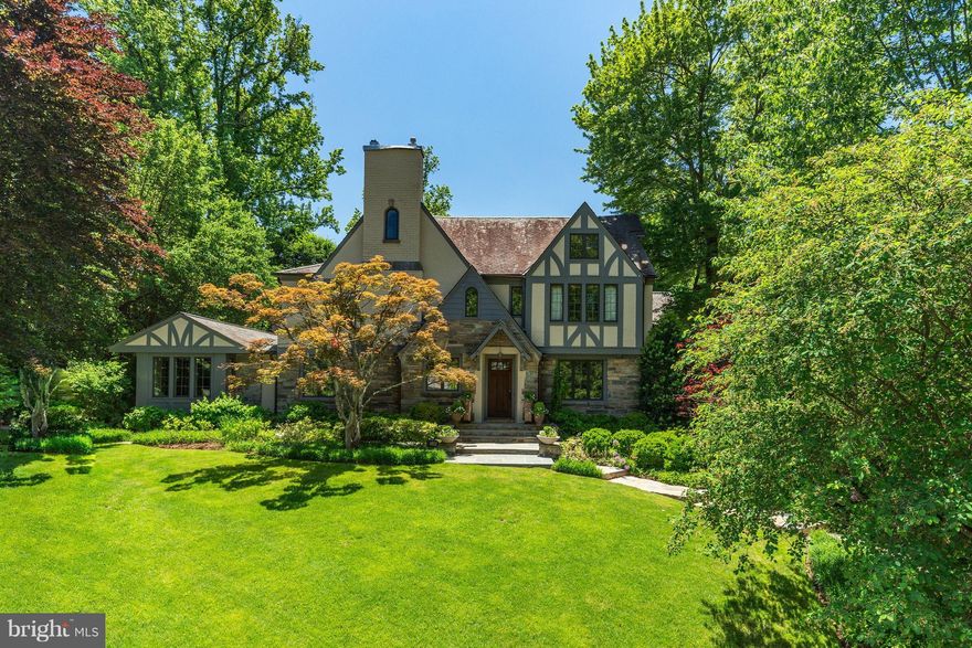 NEW LISTING! Sited on almost .5ac lot on one of Spring Valleys most sought after streets this stately Tudor feat. 8,100 sq ft of elegant entertaining & living space w/6BRs, 6.5BAs, grand foyer, beautiful LR w/coffered ceiling, formal DR, expansive fam rm, gourmet kitchen, deluxe master ste w/sitting rm, finished LL w/au-pair ste & wine cellar, att'd 2car gar w/mudrm, expansive yard & heated pool!