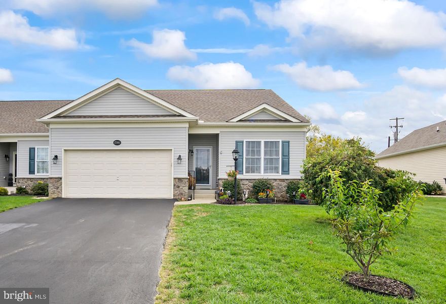 Fantastic Villa in the sought-after 55+ Community of Freedom Hills.  Beautiful one level living with features that do not come with a new build, like a the bonus Sunroom with a Gas Fireplace creating a beautiful focal point which makes this cozy and relaxing room the warm embrace of the home!  Other inside features include an inviting Entry Foyer, Open Floor Plan with Kitchen, Breakfast Bar, Dining Area all with gleaming hardwood flooring.  The Living/Family Room, Sunroom and bedrooms are carpeted.  This Villa is equipped with two bedrooms and two full baths, including The Owner’s Suite, featuring a large walk-in closet and bathroom with dual sink vanity. Convenient main level laundry and two car garage.  The spacious basement is unfinished but is insulated with improved concrete floor and includes  rough-in plumbing for an additional bathroom, there is plenty of space for storage or future expansion.  Outside is a great extension of the home with a large custom designed patio for outdoor entertaining, and beautiful landscaping around the home that is very well maintained.  The rear yard has a shed for storage that coordinates with the house color. All of this with NO City Taxes and NO HOA!!  Minutes to interstates and shopping. ***THIS IS A 55+ COMMUNITY.