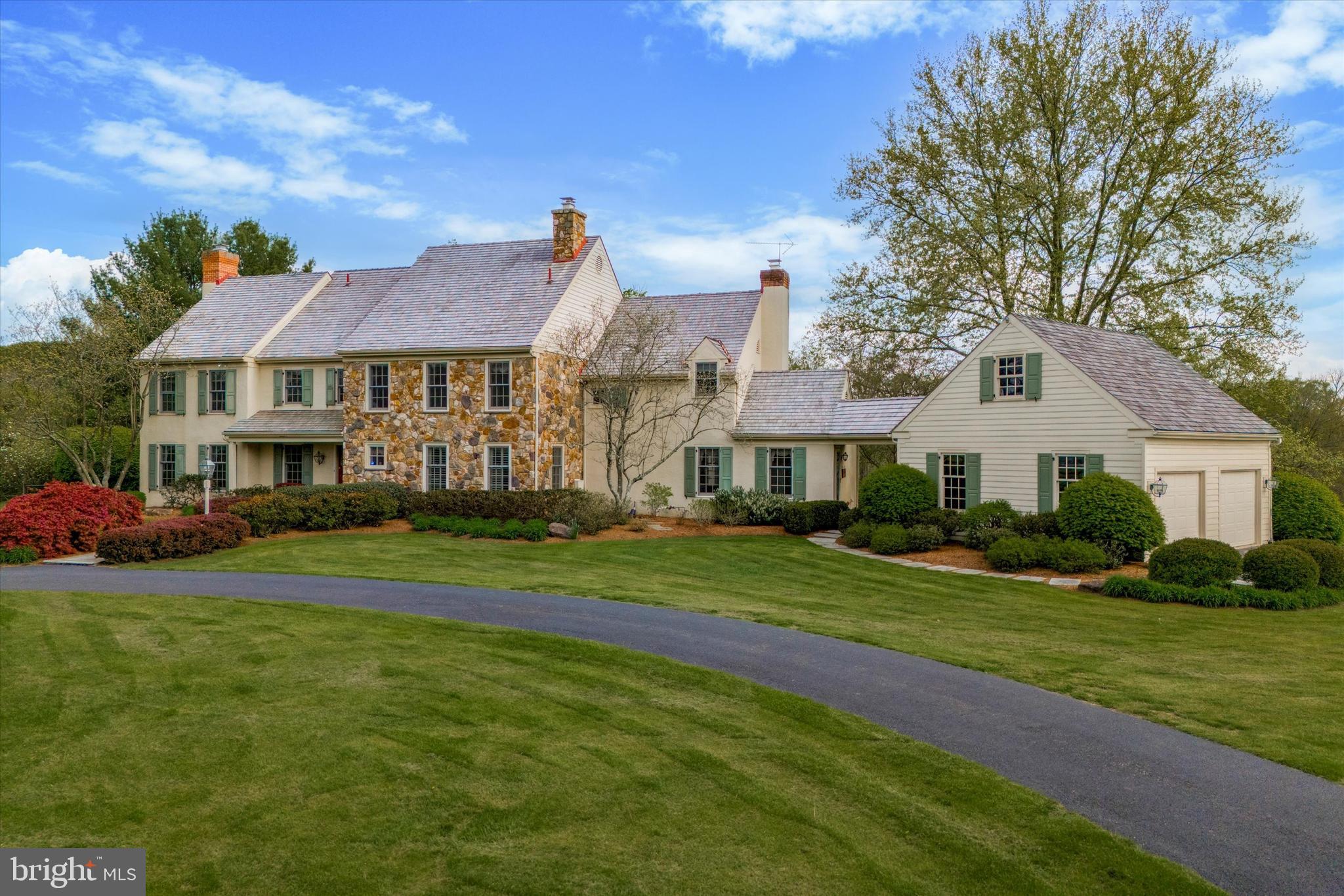 Your once in a lifetime opportunity to own the prestigious Windy Knoll Farm is here! A true oasis in the award-winning Unionville-Chadds Ford School district that sits at the highpoint of 20 acres of land, featuring 360-degree views of sweeping pastures, a fully equipped barn with horse stables and two separate residences. As you make your way over the bridge and up the serene path you will approach the circle driveway that sits just outside the estate-like primary residence. When you enter the stately main house you will be greeted by pristine hardwood floors and detailed molding that carry throughout most of the main level. The cozy living room features a stunning wood-burning fireplace and custom built-ins. Flow effortlessly through the bright dining room, with an oversized bay window, into the eat-in kitchen equipped with a double wall oven and stainless steel appliances. Just off the kitchen you will find your sun drenched family room that lends access to your patio, a separate walk-off porch, and the den (currently used as a rec room) with a stone, wood-burning fireplace and detailed arched cabinetry and shelving. On this main level you will also find your laundry room, two powder rooms, and another dignified family room with a wood-burning fireplace and built-in shelving perfect for an office. There is both a formal front stairway and a back staircase leading you to the second story. On this level you will find your massive primary bedroom with double closets, a large window seat, and a full en suite bath equipped with a spa-like jacuzzi soaking tub and glass-stall shower. Four other sizable bedrooms and a full hall bath with soaking tub and glass stall shower are also located on this level. As well as access to your large walk-up attic with a plethora of storage space. The southern side of the house captures breathtaking views of the pastures and tree-lined landscape beyond. The full, unfinished basement is the perfect canvas to add additional finished living space or for all of your storage or workshop needs. The garage is located just off the mudroom/drop zone area and adjacent to the second half bath on the eastern side of the main level, perfect for cleaning up after spending time outdoors. Outside, find your truly private oasis offering a large freeform heated pool with a hot tub and pergola that overlooks the large fenced in backyard, an entertainer's paradise! The guest house on the property is perfect for separate in-law living quarters or can serve as an income producing rental property. This 3 bed, 2 bath move-in ready single family guest house offers open concept living, with high vaulted ceilings, stainless steel appliances, laundry, its own attached garage, as well as a walk-off deck overlooking lush land and pasture.
This estate is the true equestrian's dream with a large, fully equipped barn housing a heated tack room, four stalls, a wash-stall with hot water, french drains, plus two pastures, paddock with water, and a riding rink. This oasis is conveniently located with easy access to West Chester, Unionville, Kennett Square, Wilmington, and Philadelphia. Schedule your private tour today! For those of you who have been searching for a quintessential Chester County estate, this home is a once in a lifetime, forever home opportunity that you do not want to miss!