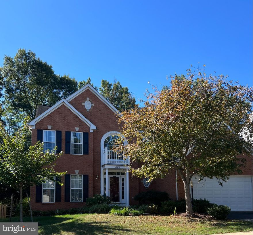 Exquisitely upgraded and truly move-in ready, this elegant brick-front Colonial is nestled in a highly sought-after neighborhood offering exceptional convenience to shopping, top-rated schools, near by Metro access, and Dulles Airport. The home showcases a refined interior with fresh designer paint, plush new carpeting, and beautifully refinished hardwood floors throughout.

The main level features a spacious living room ajoining a light filled dining room with a bay window. 
The gourmet kitchen has been thoughtfully updated with freshly painted cabinetry, sleek new hardware, quartz countertops, and brand-new stainless steel appliances, complemented by stylish new light fixtures and recessed lighting. There is a sweet eating space plus a large sunroom with skylights and two bay windows with deep windowsills, perfect for growing your favorite plants. From the sunroom you can access the custom brick patio where you can enjoy warmer weather this coming Summer. You also can relax in your spacious family room and keep cozy by the fireplace this winter. 
The main level is finished off by the study that is tucked away, a laundry room and a powder room that is updated as well. 

The upper level has the primary suite that is very spacious with a primary bathroom and walk-in closet. 
The spa-inspired primary bathroom has been fully remodeled, creating a serene private retreat. There are three additional good sized bedrooms and a full bath with two sinks. 

The newly finished lower level adds exceptional living and entertaining space, featuring a full bath, media area, and game room—perfect for hosting or relaxing in style. There is access to the backyard from the lower level.

Kitchen refinished 1/2026
Primary bath remodeled 1/2026
Lower level finished 1/2026
New roof installed 11/2025
Water Heater 6/2024
Gas Stove 1/2026
Refrigerator 1/2026
Dishwasher 1/2026
Washer 1/2026
Dryer 1/2026
HVAC 9/2016