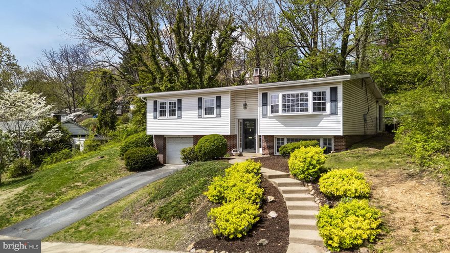 Welcome to 35 Hawthorne Road, a charming bi-level home in the Borough of Wyomissing! Thoughtfully designed living spaces make this home ideal for everyday living and entertaining. The main level features a bright living room that flows into the formal dining area with beautiful oak hardwood flooring. The kitchen offers ample cabinet space, a pantry, and stainless steel appliances, including an impressive Viking gas stove! You’ll love spending time in the spacious family / sunroom with its high cathedral ceiling, skylights, and cozy brick fireplace—perfect for relaxing or getting together with friends. Just outside, the peaceful paver patio is great for kicking back or hosting a get-together. The main floor is also home to three spacious bedrooms and a full bath. The finished lower level includes another spacious den, a laundry room and access to the 1-car garage. A bonus room—ideal for an office or guest room—and a half bath complete the space. This home is just waiting for you to make it your own! Don't miss out!