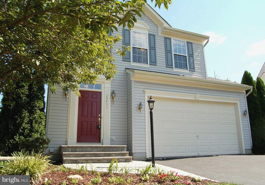 What a great home in beautiful condition!  The main level is open and spacious with a warm fireplace between the living and dining areas.  A nice deck on the main level is accessed from the dining room.  Walk out of the basement level to the patio and yard backing to a lovely grassy and treed open space.  Master bedroom has an en-suite full bath.  Second and third bedrooms share the hall bath.  Another full bath is on the spacious lower level.  Washer and Dryer are on this level.