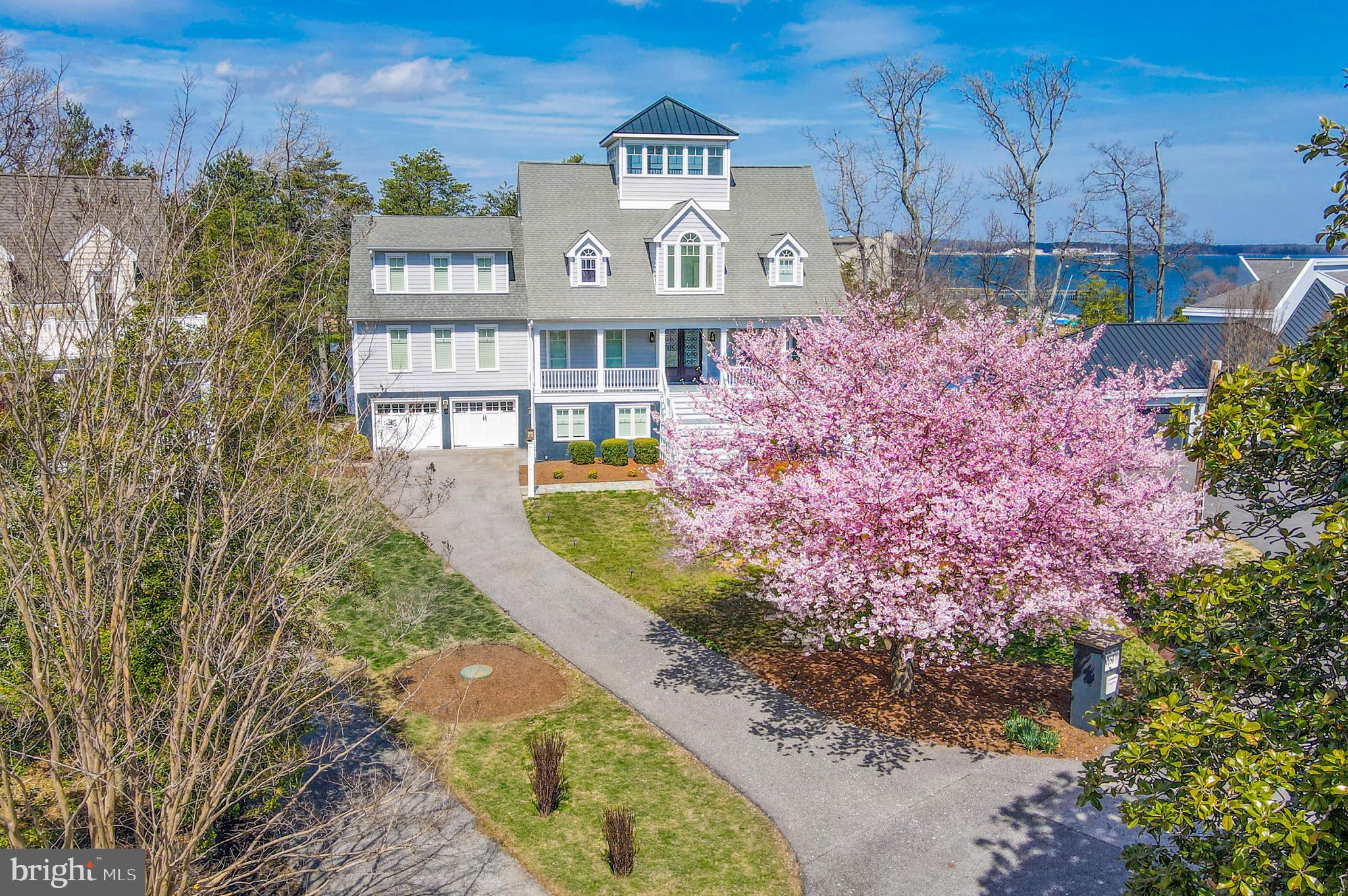 Nestled on Chase Pond along the serene shores of the Chesapeake Bay, 2680 Claibourne Court offers an unparalleled waterfront living experience. This meticulously renovated coastal contemporary-style residence boasts 5 bedrooms, 4 full bathrooms, and seamlessly blends luxury with comfort. Set on a generous 2.62-acre waterfront lot, the property features a private pier with boat lifts and a beach, providing direct access to the bay's tranquil waters. The open-concept sun-bathed main level offers a living room featuring a stone fireplace with gas insert, gourmet chefs eat-in kitchen, dining room, sitting room, a generous bedroom with walk-in closet, a full bath, and rear deck the full length of the first floor. Stunning stairs open from the lower level to the crow’s nest adds a wonderful architectural feature. The second level offers a primary suite with private balcony, beautiful bathroom featuring separate vanities, shower, soaking tub, and ample storage. 3 additional bedrooms, 1 full bath, and a large laundry room complete the second level. The 3rd level offers two additional rooms currently used as office and exercise room. The crow’s nest offers 360 degree striking views. The expansive lower level offers a recreation room, wet bar, full bathroom, mud/gardeners’ room, large 2-car garage, and abundance of storage. A flag-stone patio off the rear is great for entertaining. Outdoor amenities include a private pier with boat lifts, a beach area, and lush, landscaped grounds—perfect for boating enthusiasts and nature lovers. The home also features a whole-house sound system and is elevator-ready for future convenience. Located in the highly desirable Annapolis Roads community, this peaceful retreat is just minutes from downtown Annapolis, offering convenient access to shops, restaurants, and cultural attractions—all in a stunning bayfront setting.