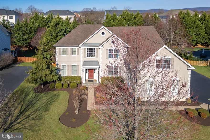 Spectacular Colonial situated on private, treed, cul de sac lot with over 6600 finished square feet.  This home features 6 bedrooms and 5 full baths and 1 half bath.  Amazing upgrades through-out home. Enter through the soaring, two story foyer with elegant dining room to the right. Gleaming, upgraded Brazilian hardwood flooring on main level. Handsome main level office with glass doors.  Gorgeous den/second office with bay window, could be used as a main level bedroom.  Oversized Family room with fabulous gas fireplace. Stunning gourmet kitchen with oversized island. Upgraded granite, cabinets and new, top of the line, stainless steel appliances. Newly renovated kitchen desk area with dual wine and beverage refrigerators.  Sun-drenched sun room with walk out to custom paver patio.  Backyard is fully fenced and super private... a true entertaining oasis. Upper level includes elegant master suite with  fabulous paladian window, coffee bar and extra custom cabinetry.  Huge walk-in closet with organizing system. Luxurious master bath with soaking tub and oversized shower. Four additional bedrooms with 3 full baths and back staircase finish off the upper level. Finished 3 car side load garage with extra shelving for tons of storage. Fully finished basement with wet bar that include a refrigerator, dishwasher and kegorator.   Rec room with pool table and  movie room. Basement also includes 6th bedroom, den and full bath- perfect for in-laws or au pair. Recent updates include: *NEW HVAC IN 2020 *NEW 75 GALLON HOT WATER HEATER IN 2020, NEW TOP OF THE LINE STAINLESS STEEL APPLIANCES, NEW HARDWOOD FLOORING, NEW CARPETS, NEW GRANITE COUNTERTOPS, NEW WHOLE-HOUSE HUMIDIFIER! All located in the award winning, gated community of Dominion Valley Country Club. Excellent schools located inside the community. DVCC amenities include: gated access, beautifully renovated clubhouse, sports pavilion, exercise room, 4 private outdoor pools, indoor pool, newly resurfaced tennis and pickleball courts, 3 basketball courts, sand volleyball, multiple tot lots, 2 stocked fishing ponds, trash, recycling & snow removal, fitness and full golf membership available.  This home is MOVE-IN ready and will not last.  MUST SEE!