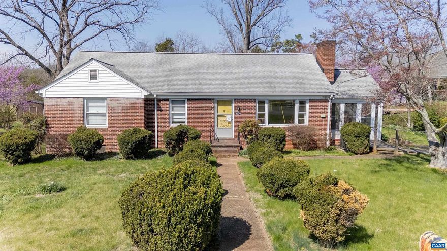 11504 Knolls Rd offers comfortable one-level living in a convenient Orange, VA location. This solid brick home features three bedrooms, one and a half baths, and classic hardwood floors throughout the main living areas. The functional floor plan includes a bright living room and an efficient kitchen with direct access to the outdoor living space, ideal for everyday use and entertaining. A full unfinished basement provides substantial storage and flexible potential for future expansion, workshop, or recreation space. The property's setting allows for enjoyable outdoor time while remaining close to local services, shopping, and commuter routes.,Fireplace in Living Room