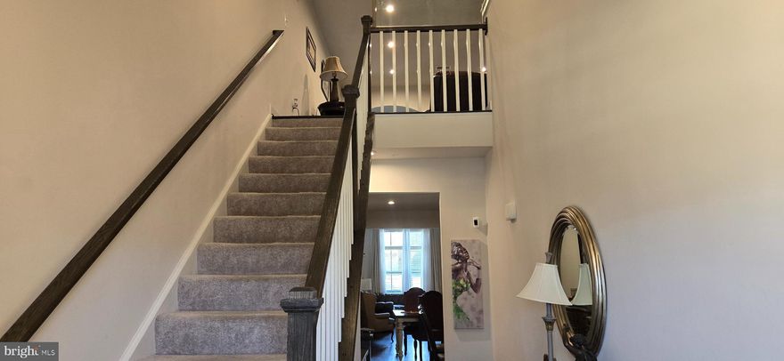 Nearly New!! Built in 2023!! This well-kept Griffin Hall Villa has plenty of space. It is larger than the neighboring townhouses, boasting of over 4,100 sq ft., an oversized 2 car garage, located in a very quiet community. Minutes from downtown Frederick, shopping, boutiques, restaurants, a farmer's market, Carroll Creek, and Baker Park. Enjoy live entertainment. This Villa could be considered as a multigenerational home, with the primary bedroom located on the main level, has its own full bathroom, double vanities, walk in shower with built in shower seat, grab bars, large walk-in closet, recessed lighting. Soaring cathedral ceilings in the family room, make it a great space to enjoy family, open floor plan, luxury vinyl plank flooring, comfortable dining, perfect kitchen space to cook up a gourmet meal, kitchen island, deep stainless-steel sink, quartz countertops, island lip for stools, beautiful 42" cabinets, and all stainless-steel appliances. A separate laundry/mud room, half bath, ceramic flooring, two car garage, plenty of storage space. Rear vinyl deck off the family room offers low maintenance and durability, additional yard space can be fenced in. Home's upper level features a large sitting area overlooking the family room downstairs. Beautiful luxury vinyl plank flooring, as well, recessed lighting, full bath, full ceramic tiled tub and shower, two bedrooms, walk in closets, and a bonus room, for an extra bedroom, den or an office. Fully finished basement, custom built in shelving, brand new top mount sliding barn doors add character, a full bath, ceramic flooring, full ceramic tiled soak tub and shower, a spacious bonus room, can be used for an extra bedroom as well. Plenty of storage space, tankless hot water heater, radon mitigation system, and more.  A must see! Schedule your appointment today.