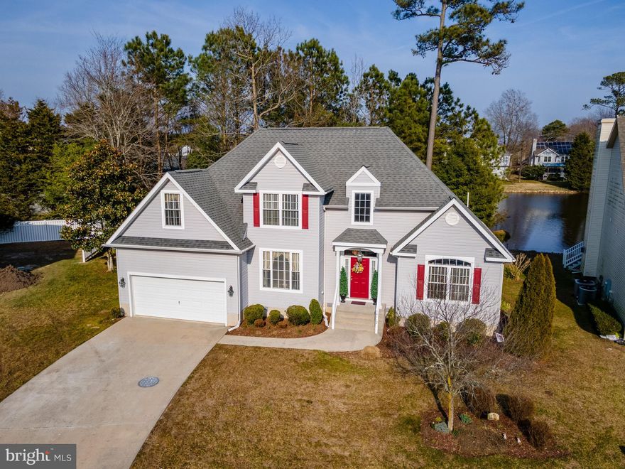 Beautiful well kept  4 bedroom 2.5 bath home on the Pond in a highly desirable community of Oyster Harbor which is located just 1.5 miles from the boardwalk and the beach.  West OC is the place to be, and Oyster Harbor offers community pool, trash, & grass cutting included in their low HOA dues.   Enjoy amazing pond views, sitting in your chair,  from the oversized living room windows that are positioned perfectly to enjoy the wildlife.