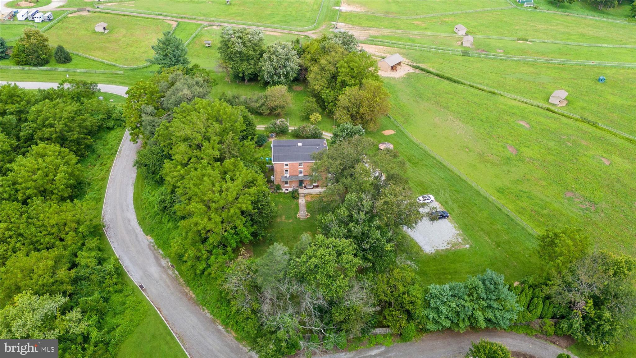 A rare opportunity awaits! Welcome home to 645 Coatesville Rd in West Grove! This exceptional farmhouse at "Stillwaters Farm", is now on the market! This beautiful property was originally deeded to the Cook family by William Penn in 1694. The farmhouse, built in 1820 by a family of Quaker farmers, is deeply woven into local history and is believed to have played a role in the Underground Railroad. This 6-bedroom, 3-bathroom home with 3,696 sq ft of living space sits on a private and generous 2-acre lot. The farmhouse offers a glimpse into its rich past with features like high ceilings, large rooms, and deep windowsills. Enjoy the surrounding beauty with stunning panoramic views year-round. The property borders preserved farmland, ensuring an undeveloped backdrop of corn and alfalfa fields. The outdoor amenities include a wrap-around porch, view of a two acre pond filled with Bass, Catfish & Perch. A gazebo, large two-level deck, mature gardens and patio, perfect for outdoor living and enjoying the sight of horses in the neighboring pastures. You'll also find an outdoor shed for storage and a fenced yard. An industrial-quality rubber roof offers lasting durability for years to come. There's ample parking for over six cars. Horse enthusiasts will appreciate the proximity to a large horse farm that offers as a beautiful backdrop. Don't miss your opportunity to own this extraordinary property!