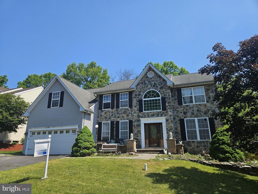REDUCED!! OPPORTUNITY KNOCKS!!! Large 3100+ sq ft, 4-bedroom, 2.5-bath stone front colonial backing to woods located in sought after Highland Woods, offering unlimited potential and a great location. This home features a dramatic two-story foyer with hardwood floors, custom moldings, and an open floor plan filled with natural light. The spacious Great Room boasts a cathedral ceiling and two-story stone gas fireplace, creating a welcoming centerpiece for everyday living and entertaining. The main level also includes the kitchen, convenient laundry room, dining room, living room and separate home office. There is a sliding door that leads to the rear deck overlooking open space. (The deck is in disrepair and cannot be walked on) Upstairs, the primary suite offers a vaulted ceiling, sitting area, his and her walk-in closets, and a generously sized bathroom with double sinks and a soaking tub. Three additional bedrooms and another full bathroom. Additional highlights include two-car garage and partially finished basement with outside access. Walking distance to Guth Elementary School and just minutes to all the exciting restaurants and shops in downtown Perkasie. Great opportunity. The layout is ideal for updating and personalizing throughout. Property is being sold in AS-IS condition. Priced to reflect condition and ready for your vision. Cash and Renovation Loans Only. Fannie Mae Homestyle Loan could be an option. PENNRIDGE SCHOOL DISTRICT! This home does need work, but it is a lot of house for the money. Bring your offers!!!