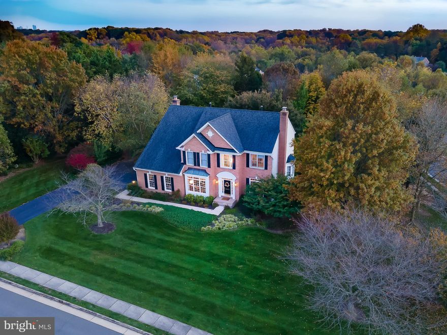 This gracious brick Colonial offers fantastic curb appeal as it sits majestically on a .85 acre landscaped premium lot in the desirable Barons Brook subdivision.  Natural light bathes this spectacular home with an impressive foyer with soaring ceilings, a main level library with handsome built-ins, and a renovated gourmet kitchen with white shaker cabinets, quartz countertops and high end stainless appliances.  There are wonderful spaces for both formal and informal entertaining with an elegant dining room for hosting special events and an inviting family room for relaxing or casual get togethers with a sliding door to the spacious deck and spectacular, flat backyard that is perfect for a pool!  The upper level features a huge primary suite with walk-in closets lined with Elfa shelving, the primary bath has dual vanities, a soaking tub and walk-in shower.  The 3 additional bedrooms are all extremely spacious and boast brand new carpeting. The walk out lower level is perfect for an extended or multi-generational family arrangement, with high ceilings, a kitchenette, built-in sound system, an in-law or au pair suite, and full walkout to a private patio, and beautiful views of the garden!!! Not only is the house spectacular, but the neighborhood has sidewalks, tree-lined streets and the most friendly neighbors!  Weekends will be an adventure with the legendary Reston Farm Market, Zoofari and Lake Fairfax around the corner and miles of trails for hiking, jogging and biking.  The Silver Line Metro and the shops and restaurants at Reston Town Center are minutes away.  Easy access to commuter options, the Toll Road, Route 7 and Dulles Airport.  Hurry to make this impressive home yours!  Open Saturday 2-4pm.