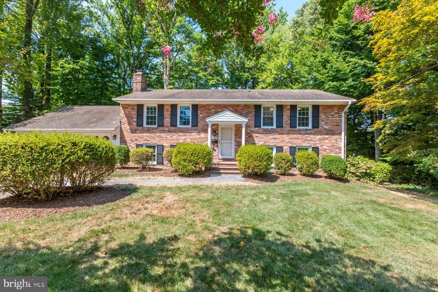 Discover serenity in this stunning home nestled on a quiet cul-de-sac, perfectly positioned to overlook tranquil woods. Over 2,800 sq ft!  The charming brick front and 2-car garage welcome you to this inviting split foyer residence boasting 4 bedrooms and 3 full bathrooms.

A stately colonial aesthetic with captivating curb appeal, highlighted by elegant white columns and an all-brick facade, sets the tone for the interior's refined charm. Step inside to find a completely remodeled kitchen featuring pristine white cabinetry, recessed lighting, granite countertops, and newer stainless steel appliances. Enhanced with stylish LVP flooring throughout, the open concept dining and kitchen area seamlessly blends modern comfort with functionality.

The spacious living room invites relaxation and entertainment, complemented by updated light fixtures throughout the home. Ample storage solutions abound with numerous closets thoughtfully integrated into the design.

Upstairs, a beautifully remodeled hall bathroom showcases high-end fixtures and a tastefully tiled tub/shower combination. Three comfortably carpeted bedrooms offer versatility and comfort, while the primary bedroom features an en-suite bathroom with a remodeled layout and a sleek glass door shower.

The lower level offers additional living space with a spacious open family room featuring a wood-burning fireplace, recessed lights, built-in shelving, and new LVP flooring. Step outside onto the backyard brick patio through the walk-out access, ideal for outdoor gatherings and relaxation.

This level also includes a generously-sized bedroom with a walk-in closet and another fully updated bathroom featuring subway tile and a glass shower door, adding convenience and style to the lower level. A workshop tucked behind the garage awaits your creative projects, providing a perfect space for hobbies and DIY endeavors.

Completing the lower level is a large laundry room featuring a utility sink, walk-in closet, and ample storage space, with a convenient door leading to the side yard.

This home feeds to highly ranked schools: Wakefield Forest Elementary School, Frost Middle School and Woodson High School.  No HOA! Walk to Ilda community pool!  Excellent location just outside the Beltway.  Easy access to Braddock Road and 495 HOT lanes. 10 minutes to VRE Express Train, 15 minutes to Springfield Town Centre, Dunn Loring Metro or Springfield Metro stations. Tour this beauty today!