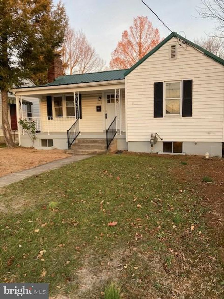 This inviting 2 bedroom bungalow sits along a quiet neighborhood street.  The updates made to this home took great care to maintain the original charm, creating a comfortable well preserved space.  Arched doorways, a beautiful fireplace, and original hardwood floors adds to the vintage charm.  New appliances, a new outside deck, and Central Air make this bungalow a perfect blend of character and modern comfort.  Two car garage with alley access.