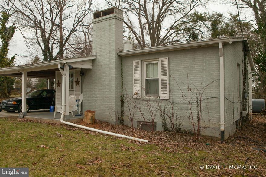 All brick 2 BR ranch style home in great neighborhood (Brown's Hill) 6 blocks from Hollywood Casino in Charles Town. Neighoborhood of stately homes. VERY nice screened porch. Nicely finished spacious family room in daylight basement. Lots of extra basement storage room or it could be improved. Tall trees, VERY QUIET. Home behind it (with pool) also for sale same owners.