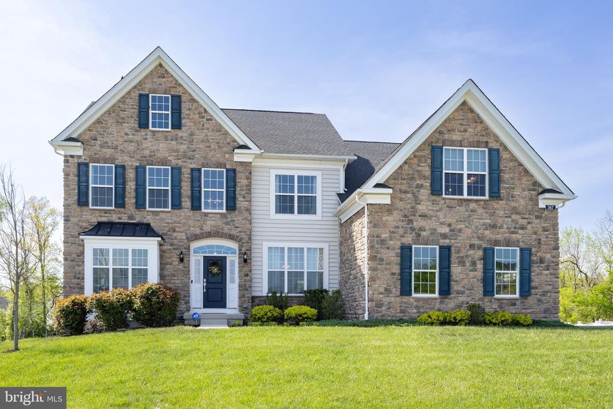 Welcome to 367 Billet Street, a stunning Dandridge Heritage model tucked into the prestigious Preserve at Kimberton Glen. This beautifully upgraded single-family home is set on a premium lot backing to community wooded open space, offering rare privacy and picturesque views in one of Chester County’s most desirable neighborhoods. This spacious five-bedroom, three-bath home showcases a thoughtfully designed layout filled with custom upgrades and timeless style. The bump-outs in the kitchen, breakfast area, and family room expand the living space, creating an open, airy layout that’s ideal for entertaining or everyday living. Engineered hardwood flooring flows seamlessly throughout the formal living room, dining room, family room, foyer, kitchen, mudroom, and upper hallway, enhancing the home’s warmth and continuity. Added windows in the living room, dining room, and main-floor bedroom help to flood the interior with natural light. The dramatic two-story family room features elegant coffered ceilings, a gas fireplace, and a full wall of windows overlooking the wooded backdrop, making it a true showpiece of the home. The gourmet kitchen is both beautiful and functional, offering white Mission-style cabinetry, River White granite countertops,  stainless steel upgraded appliances, subway tile backsplash, and an oversized center island with storage and pull-out drawers. A Palladian window above the sink frames the scenic view beyond, and custom chandeliers add a refined touch in the kitchen, breakfast area, dining room, foyer, family room, and primary bedroom. On the main level, you’ll also find a flexible fifth bedroom and full bath—perfect for guests, a home office, or multigenerational living—as well as a mudroom off the two-car side-entry garage and a separate laundry room for added convenience. Upstairs, the luxurious primary suite features a tray ceiling, sophisticated chandelier, and architectural columns that define a private sitting area. The spa-like bath includes his-and-her vanities, a large walk-in shower with frameless glass doors and decorative tile, and a soaking tub with an expanded ledge—ideal for relaxing with candles and bath accents. Three additional spacious bedrooms and a stylish full bath complete the second floor. Nine-foot ceilings on both levels add to the home’s sense of openness and comfort. Additional highlights include recessed lighting in each bedroom, beautiful window treatments throughout the home, an expanded driveway for easy access and a walk-out basement with nine-foot ceilings, offering incredible potential for future finishing. With no homes behind you and peaceful wooded views all year round, this is a true sanctuary that still keeps you close to vibrant town centers and plenty of outdoor recreation. Ideally located just minutes from the historic village of Kimberton and downtown Phoenixville, this home offers the best of Chester County living. Kimberton’s charm is evident in its quiet streets, boutique shops, the local co-op, and the renowned Kimberton Inn—perfect for a relaxing dinner. Phoenixville offers a dynamic mix of dining, shopping, art galleries, and entertainment, including the Colonial Theatre, farmer’s markets, and seasonal festivals. Outdoor lovers will enjoy proximity to the Schuylkill River Trail, French Creek, and Valley Forge National Historical Park. Convenient access to Routes 113, 23, and 724 ensures an easy commute while keeping you connected to the region’s best amenities. Don’t miss the opportunity to make this spectacular Dandridge model your forever home. Be sure to check out the virtual tour link available in the MLS.