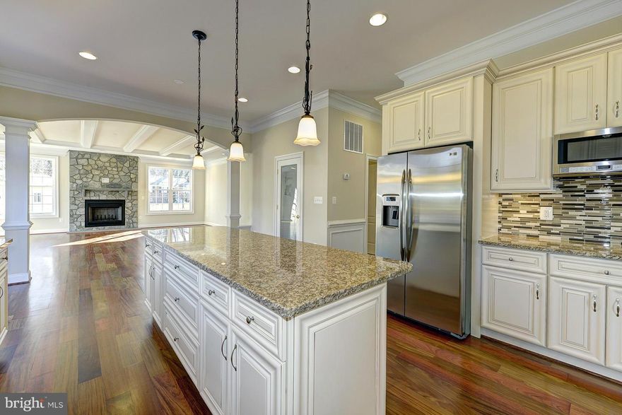 Reduced to sell NOW! Lavish custom detailing built w. highest level of quality, distinctly elegant details & exceptional workmanship.With over 5400 sq ft of meticulously appointed living space, the entertaining possibilities abound w. spacious rms,high ceilings,exquisite Brazilian Cherry hdwd flrs & much more.Fabulous kit. a gourmets dream w. top of the line appls. designer cabs & granite ctrs.