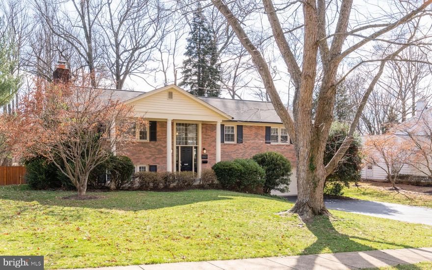 Gorgeous renovated all brick colonial home over 4200 square feet with HUGE two-story rear addition to include a new formal dining room, breakfast room, library or den, bedroom or exercise room, and a rear second staircase, all on a half-acre level lot inside the beltway with convenient Falls Church location.  The dramatic bright foyer welcomes an open floor plan offering multiple large rooms, including five possible bedrooms and three impressive fully updated bathrooms.  Owner spared no expensive in recently updating every inch of this home spending over $130K!  Enjoy the beautiful oak hardwood floors throughout with two fireplaces, gourmet kitchen, deck overlooking private yard, field stone terrace and wooded space. Extra features include two staircases, party room with full wet bar, large activity rooms, crown moldings, wooden blinds, and multiple double French doors.  The master bedroom has a 'room sized' walk-in closet with built-ins, and a lovely, new top-notch bathroom with dual square sinks, expanded shower with seamless glass, and extensive cabinet space. The two-car garage has even been enhanced with special features. The 'shed' alone was $25K.  Other improvements include newer roof, newer hvac, new windows, new asphalt driveway and many updates throughout!  Hurry!  Don t miss this unique opportunity!  OPEN HOUSE SATURDAY 2/15 1-4.
