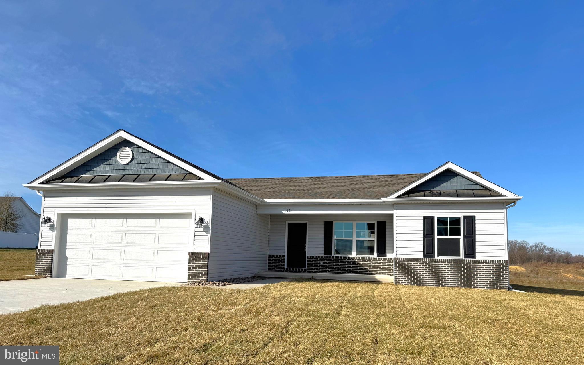 To Be Built 1342 sqft Rancher with open floor plan, vaulted ceilings and LVP Flooring in main living areas, and Kitchen with island, granite countertops, and stainless steel appliances. The primary bedroom has full bath with tile shower and large walk-in closet. The exterior features brick accents on front, 2 car garage with auto opener, and concrete driveway included.