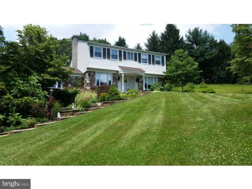 WELCOME HOME to this beautiful 4 bdrm 2 1/2 bath Stone/traditonal home in a wonderful culdesac in the of Rollinwood in Westtown.  Award Winning West Chester Schools.. This house has it all !! Beautiful yard that is 1.35 acres. Enter through the lovely Center Hall with glistening hardwood Floors throughout the house.  The large sunlit Living Room runs from front to back of the house, Lots of Windows with views, this living room  opens out to the back of the house with beautiful Pella french doors to a large Patio and then Deck.. On the other side of the Hallway is large sunlit Dining Room  which lead to a beautifully appointed Kitchen with gorgeous raised Cabinets, new sink and faucet, gas cook range and oven, back door off to a large deck or Patio, that runs the back of the house, this all overlooks the yard and trees. The expansive yard is very large and peaceful,. Step down to the extra large great room above the two car garage, beautiful wood paneling, Large Picture Windows and brick fireplace, Even in this room are another set of Pella french doors off to the deck overlooking the yard . The powder room completes the first floor.  The second floor has a  Master bedroom, with master bath , 3 additional good size bedrooms and nice size hall bath with new toilets.  hardwood floors throughout and lots of closets. The Basement is walkout and so is the garage to a newly done large driveway.  Plenty of storage.. the house was just converted to gas and whole house air conditioning was added. The  vinyl siding is newer , as well as roof, gutters, windows, this is a great house that needs some Updating in Kitchen and bath. This house has great potential .  Bring your Buyers.