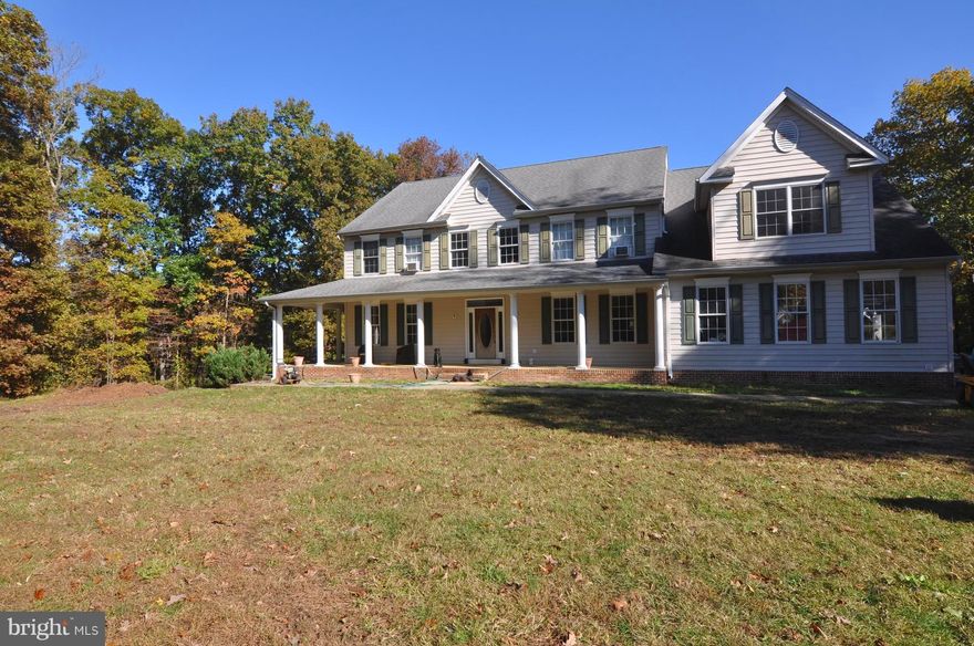 This beautiful custom-built home is situated on 18.41 acres of wooded, private land just minutes from the new Crofton High School, commuter routes and shopping!  One of the most unique and magnificent properties in the area!  One has the luxury of accessible conveniences yet seclusion from the hustle and bustle.  The property offers open space, woods, and a scenic stream.  There are trails for dirt bikes, atvs, horses, goats, chickens.  Hunting on the property is permitted.  Plenty of space to park boats, construction equipment, camper, etc.  Location, privacy, relaxation and recreation - this home has it all!  Center-hall colonial with wrap-around porch offers  5 bedrooms, 3 full and 2 half baths.  Master bedroom has tray ceiling,  separate sitting room w/rough-in for wet bar, attached master bath and walk-in closets.  2-story foyer,  9 ft. ceilings.  Crown molding and chair rail throughout.  Light and bright open kitchen and fam room, large deck off the kitchen, 2 wood burning fireplaces (fam room and basement), finished basement w/wet bar, over-sized 3-car garage. The house does need repairs - needs new flooring, A/C, paint, tile in the master bath shower and some general TLC.  Please note - the list price is based on the repairs the property needs.  The property is being sold As-Is.  Continuing to show for back ups.
