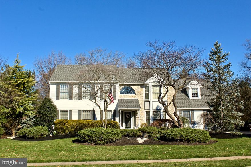 Your home search ends here with this outstanding Upper Gwynedd home! Located on a corner, cul-de-sac lot nestled across from Upper Gwynedd’s Garfield Avenue Park, this home offers a retreat from the hustle and bustle but with the convenience to access all that this area offers.  A lovely landscaped walk leads to the front entrance.  Stepping inside you will find a welcoming two- story foyer bathed in natural light with gleaming hardwood flooring, custom fitted solid wood wainscoting and  turned staircase. Throughout this home are impeccable, high end improvements.  The formal dining room boasts hardwood flooring, triple bay full length windows, as well as chair and crown mouldings.  Across the foyer is a step down living room with hardwood flooring, chair and crown mouldings, and pocket doors that open to the family room. This feature provides a wonderful flow to the home. In the family room, you will enjoy a panoramic view of the rear, fenced-in,  outdoor oasis.  The family room also features natural custom crown and dentil mouldings and trim and a comforting propane gas fireplace. From the family room step up to the splendid custom, gourmet kitchen! Here you will find a light-filled eating area with views of the amazing outdoor space, natural stone counters, ceramic backsplash, and breakfast bar. Other enhancements to the kitchen are the custom cabinetry; tile flooring; dual control, programmable Lightolier Tresco multi-set lighting and dimming system with recessed lighting and accents; Thermador Professional propane gas, six-burner combination cooktop with simmer feature; double ovens with roast & convection features; Sub Zero refrigerator & freezer; under counter ice maker for your entertaining convenience. Rounding out the main level is a laundry room with custom cabinetry, and access to rear yard and garage as well as a convenient half bath.  On the second level there are three well sized bedrooms, a lovely, full hall bathroom with linen closet, ceramic flooring & tile and a custom vanity.  Also on this level is the primary suite with its architectural cathedral ceilings and walk-out triple bay window. This tranquil refuge provides a spacious sitting room adjacent to the bedroom and a full luxurious bathroom.  Bathroom amenities include a ceramic tile shower, soaking tub, skylight, and cathedral ceiling. In the lower level of this home is a large finished space for your enjoyment, an additional finished smaller room, full bathroom, and hall leading to the exit to the incredible rear yard.  Inside the home, there is ample closet and storage space throughout.  Enhancing all that this home offers is the spectacular outdoor oasis with its Trex Brazilian double deck area, in-ground American Eagle Altadean heated pool, elevated stone  jetted spa, and masonry decking. MAJOR IMPROVEMENTS to this home include New Roof - 2018; Leaf Filter System - 2021: New Generator - 2021; Heating System with 3 Zones - 2018; Central Air Conditioning with One Zone - 2020. Additionally, this home is located in the highly respected North Penn School District and is convenient to major routes, regional rail, parks, shopping, restaurants, and a variety of entertainment options.   Owner is a PA licensee and looks forward to welcoming you to your new home!