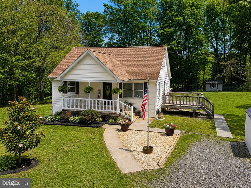 Welcome to 6235 Scottsville Rd—a beautiful Cape Cod perfectly set on a picturesque 1.89-acre (with both lots) in the heart of Jeffersonton. Framed by mature Red Oak and Tulip Poplar shade trees, along with vibrant crepe myrtles, magnolia, and native redbuds, this property offers the kind of peaceful, open setting that is increasingly hard to find.

Inside, the home features a highly desirable layout with a main-level bedroom suite complete with its own en-suite bath and spacious closet—ideal for one-level living or guest accommodations. A second full bathroom on the main level adds convenience, while the front living room offers a welcoming space filled with natural light. The kitchen is both functional and impressive, showcasing a gourmet stainless steel setup with cooktop, upgraded Whirlpool smart double wall ovens, a newer refrigerator, and a stylish tile backsplash—all thoughtfully updated for modern living.

From the kitchen, step out onto the expansive full-width rear deck—perfect for entertaining, grilling, or simply enjoying the quiet surroundings. A secondary side deck (also off of the kitchen) provides additional access to the driveway side and flexibility for everyday use.

Upstairs, you’ll find two generously sized bedrooms, each featuring walk-in closets and abundant, easily accessible attic storage—no ladder required.

The well lit walk-out basement spans the full footprint of the home and offers excellent potential for future finished space, workshop use, or additional storage.

Outdoors, the property truly shines. The open, usable acreage is ideal for gardening, recreation, or simply enjoying the natural beauty. Established perennial landscaping—including hostas and irises—returns year after year, creating a low-maintenance and colorful landscape. Three detached storage sheds provide added versatility, including one outfitted with a deluxe chicken coop and run.

Significant updates and improvements include: Roof 2018, flooring (2018), cabinets (2018), tile showers (2018), tankless instant hot water (2018), concrete sidewalks (2018), furnace replaced (2019), firepit installed (2019), deluxe coop with run and lofted barn-style shed added (2019), kitchen updates including backsplash and microwave/vent hood (2021), whole-home water softening and filtration system (2023), Kohler commercial-style sink and faucet (2023), refrigerator (2024), Whirlpool smart double oven (2024), washer and dryer (2024), freshly updated bathrooms (2025), upgraded dishwasher and range (2025), well pump replaced (2025), along with refreshed paint and updated lighting and ceiling fans throughout.

The home is also wired for Xfinity cable TV and high-speed internet—bringing modern connectivity to this peaceful country setting.

This is a rare opportunity to own a thoughtfully updated home on a beautiful, usable lot with space, privacy, and flexibility—just a short 20 minute drive to Warrenton, Culpeper, and major commuter routes.