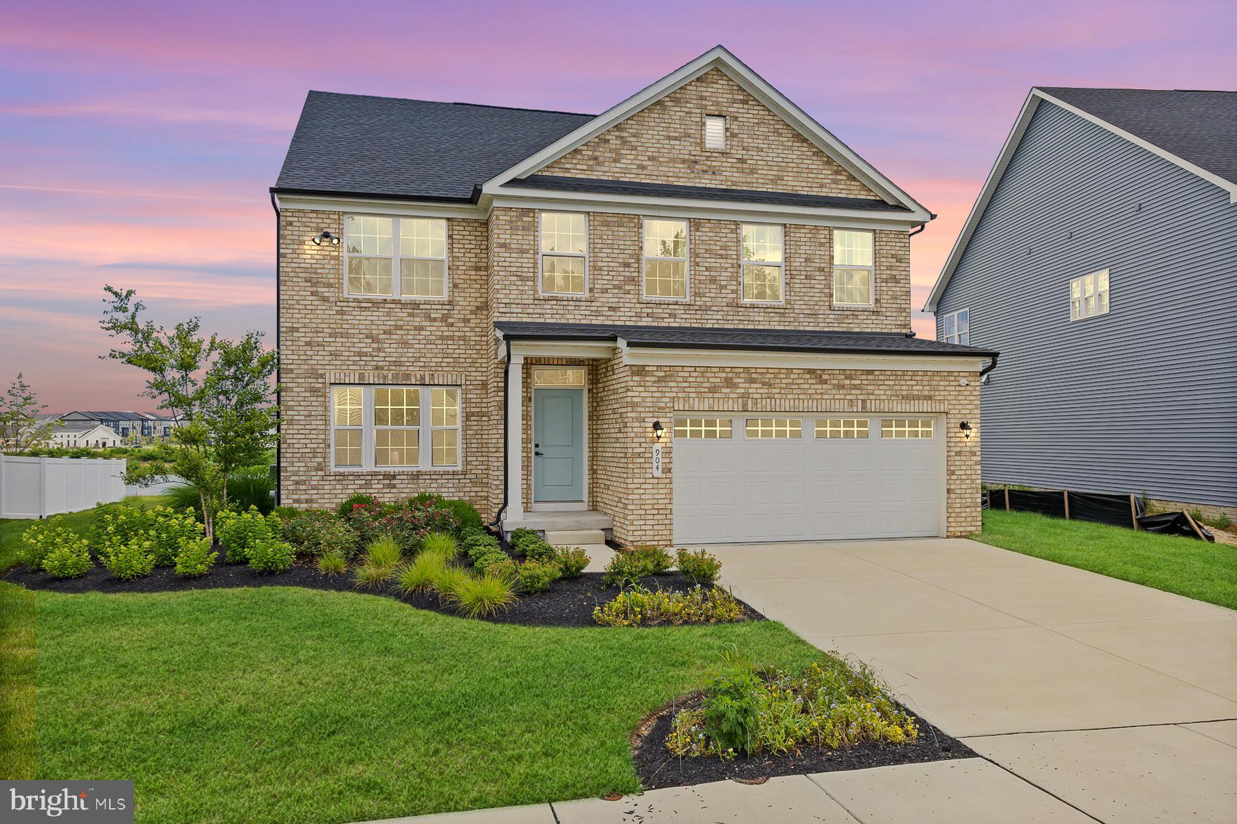 Stunning Former Model Home in South Lake community in Bowie! Built in 2023 and loaded with over $120K in premium upgrades, this Ryan Homes former model showcases the perfect blend of luxury, comfort, and functionality. Enjoy wide plank LVP flooring throughout the main level, a gourmet kitchen with stainless steel appliances, expanded center island, custom pendant lighting paired with under-cabinet lighting and open-concept living that flows seamlessly into a spacious great room. The main level also features a formal sitting room and a versatile bedroom or office with a full bath—ideal for guests or multigenerational living. Enter from the garage to your mudroom with a custom built arrival center. Upstairs offers three generous secondary bedrooms, a hall bath, a private en-suite guest bathroom, and an oversized primary suite with tray ceilings, two walk-in closets and a spa-inspired en-suite bath featuring dual vanities, upgraded fixtures, dual shower heads, and a bench seat. The fully finished lower level includes a large rec room, unfinished bonus room/flex room, full bathroom and walk-up access to the backyard. Step out onto the covered porch and take in serene views of the community lake, walking paths, and adjacent tot lot. Enjoy the simplicity of a fully integrated irrigation system for your garden and yard. Fully equipped Community center with fitness center and lounge area, outdoor pool, community walking path and beautiful tree lined lake are right at your fingertips. A 5-year CINCH home warranty conveys for peace of mind. Don’t miss this exceptional opportunity in one of Bowie’s most desirable new communities!
