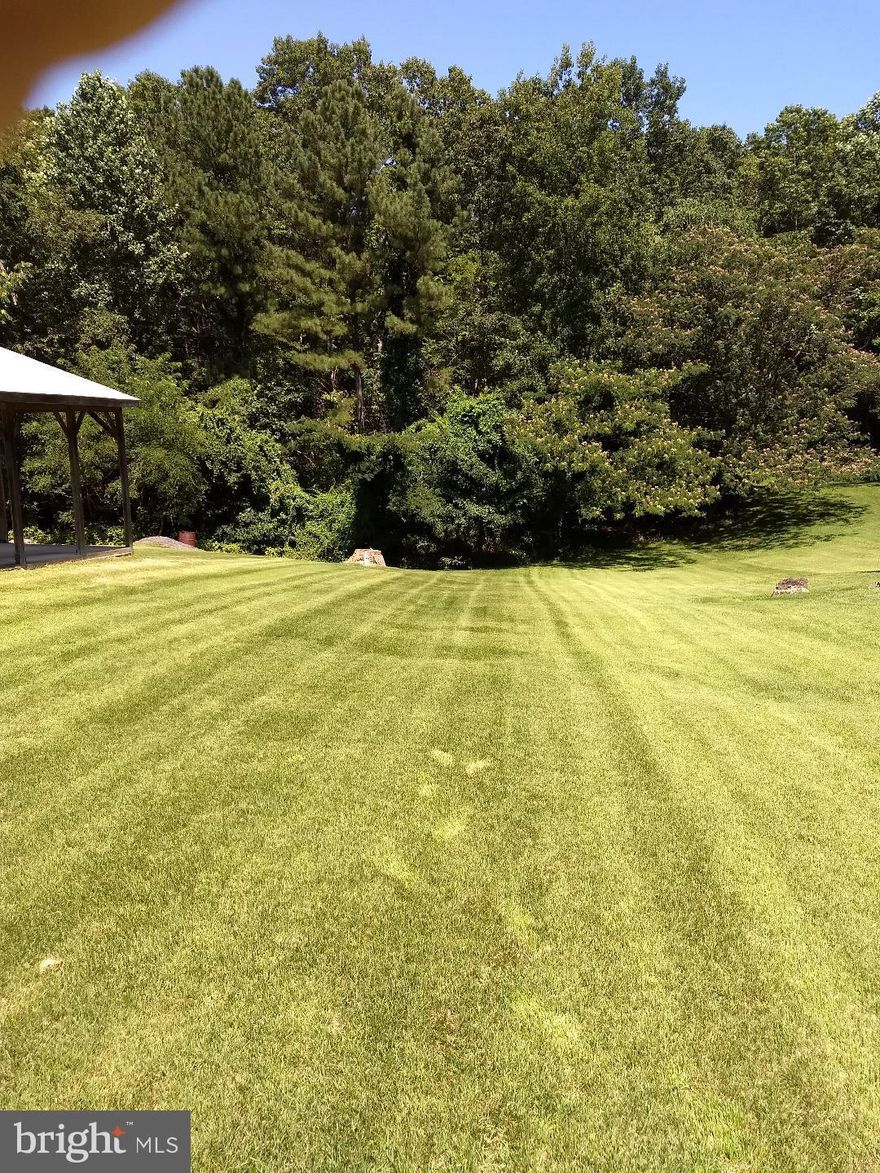 Reduced for Quick Sale! May renew perc.  Wooded one and 46 hundreds of an acre,  (1.46) flag lot.