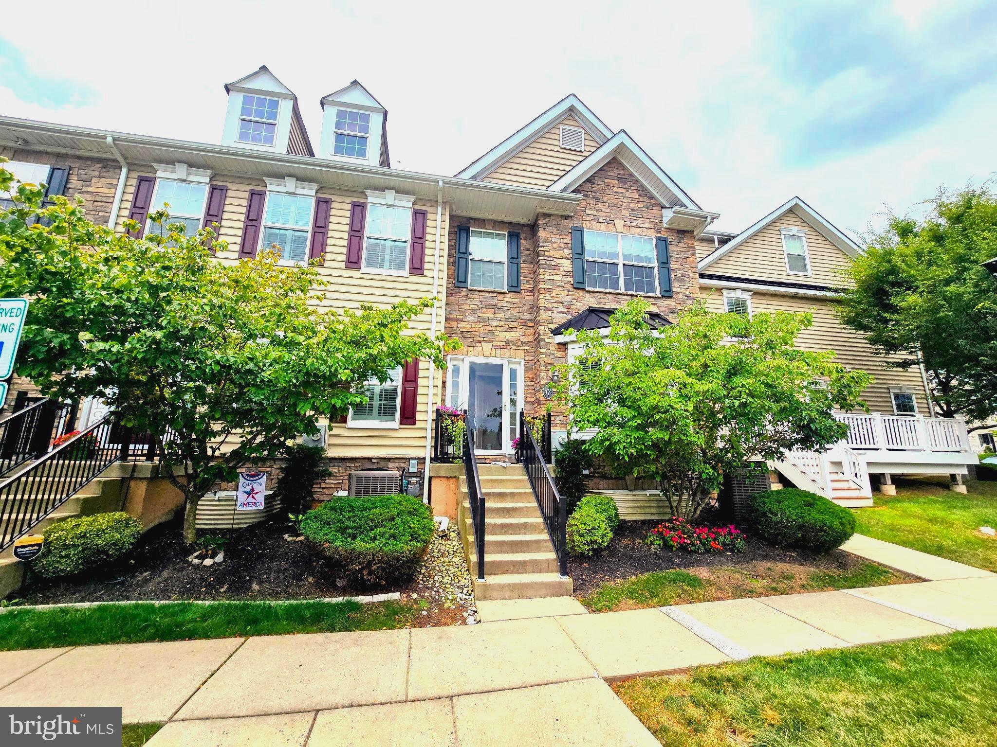 Desirable end-unit townhouse in Carriage Hill just minutes from downtown and top-rated Central Bucks Schools. This stylish 3-bedroom, 2.5-bath home features hardwood and LVP flooring, an open-concept layout, and a fully finished basement offering extra living space. The bright and inviting living area includes a cozy fireplace, perfect for relaxing evenings. The gourmet kitchen includes granite countertops, 42” cabinets, a center island, and a walk-in pantry. Sliding glass doors lead to a private patio, ideal for outdoor dining or relaxation. The spacious owner’s suite boasts a walk-in closet and private bath, while the second bedroom and full bath are conveniently located on the same level. A third-floor loft adds flexible space ideal for a bedroom, office, or guest room. The finished basement includes a large recreation area, laundry room, and additional storage. Enjoy parking and open green space right in front of the home. Community amenities include a park, playground, walking trails, and basketball/soccer courts. With easy access to Peace Valley Park, shopping, dining, museums, and major routes (202, 611, 313), this move-in-ready home is packed with comfort, space, and upgraded style.