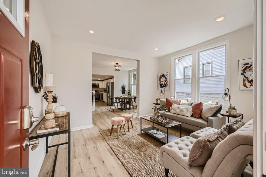 This is the one you've been waiting for! Beautifully renovated-from top to bottom- and located on a quiet street in the ever-so desirable Lauraville Historic District. Walk up to the newly constructed front porch and enter into the bright and spacious home. The whole home features brand new lighting, new windows, luxury vinyl flooring, and designer touches. The gourmet kitchen boasts stainless steel appliances, quartz countertops and white shaker cabinets. Walk out from your kitchen onto the brand new  deck overlooking an expansive flat backyard.  Plenty of room to entertain or relax. Find comfort and privacy upstairs in the large primary suite featuring its own lux bathroom equipped with a rain shower head! In the fully-finished basement, you will find a convenient full bathroom and another bedroom along with a large rec space. This home feels large and inviting! Improvements and upgrades include new roof, siding, HVAC system, appliances, water heater, electrical, plumbing, new front and rear decks . There's nothing you have to do other than move in! Then invite guests to celebrate and park 4+ cars on the private (and newly constructed) asphalt driveway or in the detached garage. You will have more than enough space for all the parties this Summer! Schedule your appointment today.