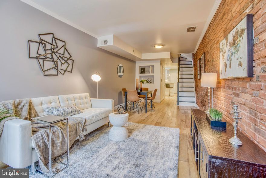 REDUCED $10K! Contemporary 2 bedroom 1.5 bath home with bonus office/den area.  Prime Fells Point location!  Walk to the waterfront and all the best shops and restaurants the area has to offer.  Great views from hall access roof deck, hardwoods, stainless appliances, granite counters, and 1st floor laundry/storage room.  Resident only permit parking .  Rare price point for renovated home in coveted Fells location.