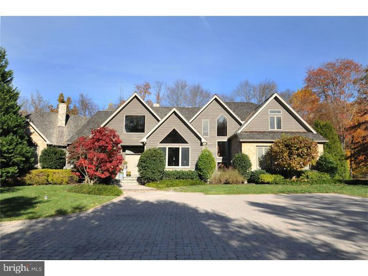 Exceptional Custom Manor Home with 1st floor Master Suite, Finished Walkout Lower Level & heated Pool & Spa, located on a secluded wooded lot, backed by protected land, within a private enclave of 5 custom homes in Lower Gwynedd, blending exciting contemporary architecture with traditional superior amenities to create a masterpiece for entertaining or comfortable relaxation. Curved walls, high ceilings, custom millwork & walls of windows accentuate the home thru-out. A stunning gourmet kitchen w/granite counters, stainless appliances, commercial range, 3 ovens & center island features a 2-way floor-to-ceiling stone FP shared by the Great Room. A fabulous Butler's Pantry w/2 granite counters & 2 wrap-around pantry closets connects the Kitchen to the extra-spacious Dining Room w/granite buffet, vaulted ceiling & door to exterior. The sun-drenched Great Room w/curved granite bar features a wall of windows providing a breathtaking view of the wooded grounds. Etched glass doors open to 1st Floor Master Suite featuring a gas floor-to-ceiling stone FP, screened porch, "his" & "hers" separate bathrooms w/connecting shower, radiant heated floors & "his" & "hers" enormous custom walk-in closets. The laundry room is separate from the mud room that features a dog bath plus entrance to the garage. The 2nd floor includes 3 spacious bedrooms with en-suite baths plus loft. Entertain or play in the finished Lower Level w/Recreation Room, Gym, 5th Bedroom w/full bath & Putting Green. The rear paver patio overlooks the gated, heated spa & pool w/waterfall. 2 screened porches & 1 balcony also overlook the secluded grounds. The garage is currently designed for 2 cars with 3 doors and could easily be reconverted back to 3 bays. Other special features include a cedar-shake roof, 4 zones of heat & a/c, laundry chute, & security system. The property is surrounded by walking trails & is close to excellent shopping & restaurants, with easy access to train station & major routes. 1 Yr Home Warranty included. This is an amazing opportunity.