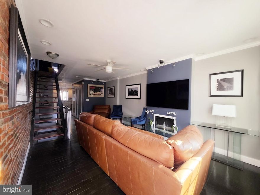 One of a kind in Washington Village / Pigtown! Welcome to 1139 Scott Street, the only home on the block with a fourth level, featuring 4 bedrooms, 3.5 bathrooms, and a private elevator with access to all four floors. This exceptional home offers two-zone central air, hardwood floors, a modern open layout, and striking floating stairs from the main level to the second floor.

Designed for entertaining and city living, enjoy three decks, including a full-length fourth-floor deck with stunning city skyline, Camden Yards, and M&T Bank Stadium views—perfect for game days and fireworks. Additional outdoor spaces include a second-floor deck with French doors and a deck off the kitchen.

The entire fourth level serves as a private retreat featuring a unique glass primary en suite accessible from both the bedroom and hallway. The rear space on this level is flexible and can be used as a bedroom, sunroom, or lounge, complete with skylights and direct deck access.

Ideally located just steps from Cross Street and Carroll Park, and within walking distance to Downtown Baltimore, Camden Yards, and M&T Bank Stadium. Close to major highways, hospitals, a new entertainment district, as well as shops and restaurants. Enjoy vibrant community events like the annual Pigtown Festival and warm summer nights in one of Baltimore’s most exciting neighborhoods. A rare opportunity—must see!