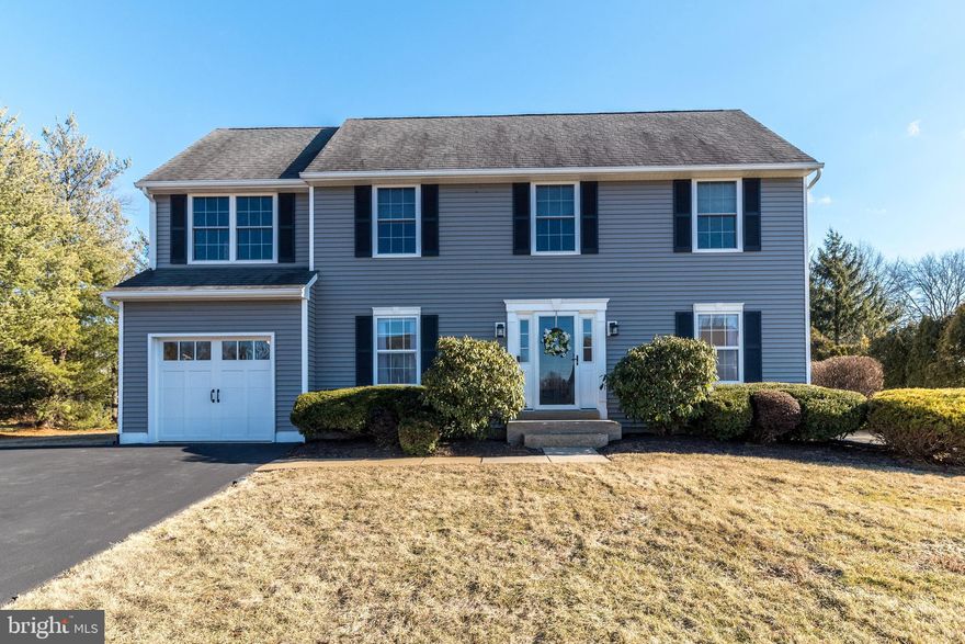 Adorable 4 bedroom 2.5 bath salt box colonial  with great curb appeal situated on a lovely 1/2 ac lot.    Entertaining is fun with a bright open concept floor plan featuring a kitchen and breakfast room overlooking a spacious family room .  Freshly painted,  this area is enhanced with chair rail moldings and shadow boxing extending up the stairs and through the second floor hallway.  The kitchen features SS appliances, granite countertops, recessed lighting, bar stool seating and ample cabinets.   The adjacent breakfast area has a buffet counter w/prep sink, granite counters and cheerful wall of windows.  Adding character to the family room is a vaulted ceiling and second floor balcony overlook , gas fireplace and fresh neutral paint.  The formal living room and dining room share chair rail & crown moldings and wood floors that extend through the family room .   Upstairs the master bedroom has a large walk-in closet, wood flooring, crown molding , ceiling fan and private bath with a built-in vanity area.  Three nicely sized bedrooms each with double closets and ceiling fans are nicely sized and have decorative shelving.  A huge hall bath completes the second level. There is a work shop area in the basement and the beginnings of a recreation room that would be easy to complete.  Out back enjoy the deep rear yard and the oversized Timber Teck deck with lighting and a roll out awning.  Step down to the  paver patio and firepit.   The siding, gutters and garage door were replaced in 2020 and the driveway was repaved in 2021.  A full house generator is included.   This house is Move-in-Ready  and short distance to schools and shopping.  Make it yours now!