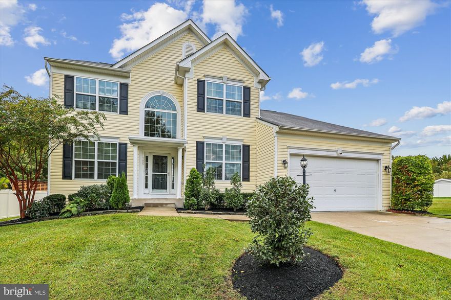 Welcome! This beautifully designed home offers generous living space across three finished levels, blending style, comfort, and functionality. Enjoy an open and elegant main level with wood floors throughout. The chef’s kitchen features quartz countertops, a blue island, dual sinks (including apron-front), pot filler, double oven, stovetop, stainless steel appliances, and a walk-in pantry. The kitchen flows into a bright dining area and cozy family room with a gas fireplace and separate sitting area. A formal dining room, living room, mudroom with sink, and two staircases (one at the entry and one from the kitchen) complete this level. Upstairs you'll find the spacious primary suite including a sitting area, walk-in closet, and en suite bath with double sinks, large tiled shower, and separate tub. There are three additional bedrooms on this level. One has its own en suite, while two others share a Jack and Jill bathroom.  The fully finished basement is perfect for guests, extended family, or an in-law/au pair suite. It includes a large bedroom with both a walk-in and standard closet, a beautifully appointed en suite bath with dual sinks and a tile shower, a generous recreation room, and a full kitchen with granite countertops, white cabinetry, apron sink, and space for dining or lounging. Step outside to enjoy a deck and a covered concrete patio—perfect for relaxing or entertaining. This home is located with convenient commuting to Fort Meade, Baltimore, DC, or Annapolis. This home is a perfect blend of comfort, luxury, and thoughtful design.