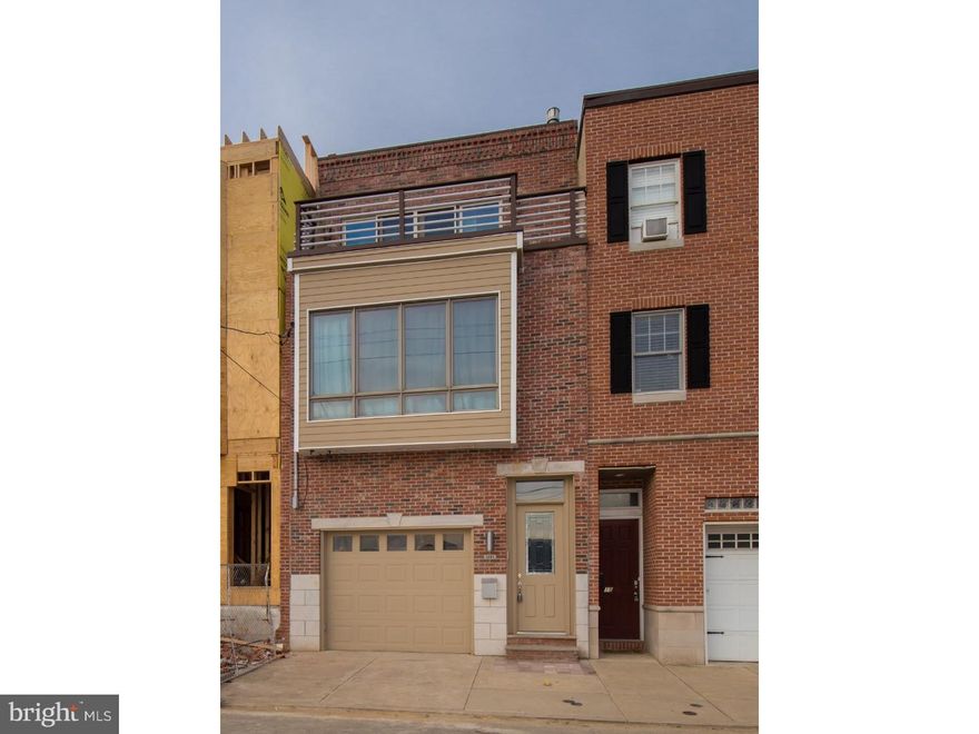 Large 4-5 Bedroom Graduate Hospital home with GARAGE Parking! Amazing 18' wide house that features Brazilian Cherry floors, high ceilings, crown and chair molding, custom staircase with open treads, a contemporary railing system, Dual-zone HVAC, 2 water heaters, and approximately 5 years remaining on tax abatement. The tiled entry leads you to the open concept living room, kitchen and dining  area. The kitchen offers plenty of counter space with granite countertops, custom design cabinets, 6-burner Viking stove, large Bosch refrigerator, 2 sinks, built-in microwave, wine fridge and slate floors. Sliding doors lead you to large patio, which is the first of 4 outdoor spaces. Downstairs, the finished basement with full tiled bath could be an extra guest bedroom or entertainment space with wiring for surround sound. As you continue up to the second floor you are welcomed with 2 very generous sized bedrooms both with walk-in closets with custom shelving. The shared 4-piece tiled hallway bath looks like a master bathroom: Radiant floors, dual sinks, glass stall shower and Jacuzzi tub. The laundry ROOM with floor drain is also located on this floor. The third floor has your master suite and an additional bedroom. The master suite offers a gas fireplace, sliding doors to a walk-out balcony, 2 closets with custom shelving and a 4-piece master bath with radiant floors, dual sinks, glass stall shower and Jacuzzi tub. Off the hallway is an intimate deck and a wet bar for the roof deck just up the next flight of stairs - with AMAZING city views. Nearby amenities: Lincoln Square: home to Sprouts Organic Farmers Market, PetSmart, Starbucks and Target and Insomnia Cookies. Minutes from Rittenhouse Square and an abundance of restaurants. A few blocks from the Broad Street Orange Line. Check OPA for 2019 taxes due to possible citywide reassessment.