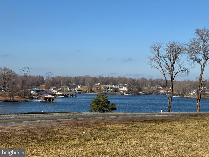 RARE WATER VIEW lot, very close to the water, comes with covered deeded boat slip, located in Lake Anna's most popular and newest subdivision: Rock Island Landing!  This buildable water access lot on the private side of Lake Anna will give you big views of the water, without the big price tags of water front lots these days.  This lot is close enough to throw a rock into the water, and gives you gorgeous views of Lake Anna.  Comes with a deeded covered boat slip in the nearby water access area.  Enjoy extended boating and swimming seasons in the warmer water of the private side of the lake.  Close to groceries, restaurants, gas stations, and the famous "Elk Creek Country Store".  Water access lots at Lake Anna with water views sell quickly, so jump while you still can.