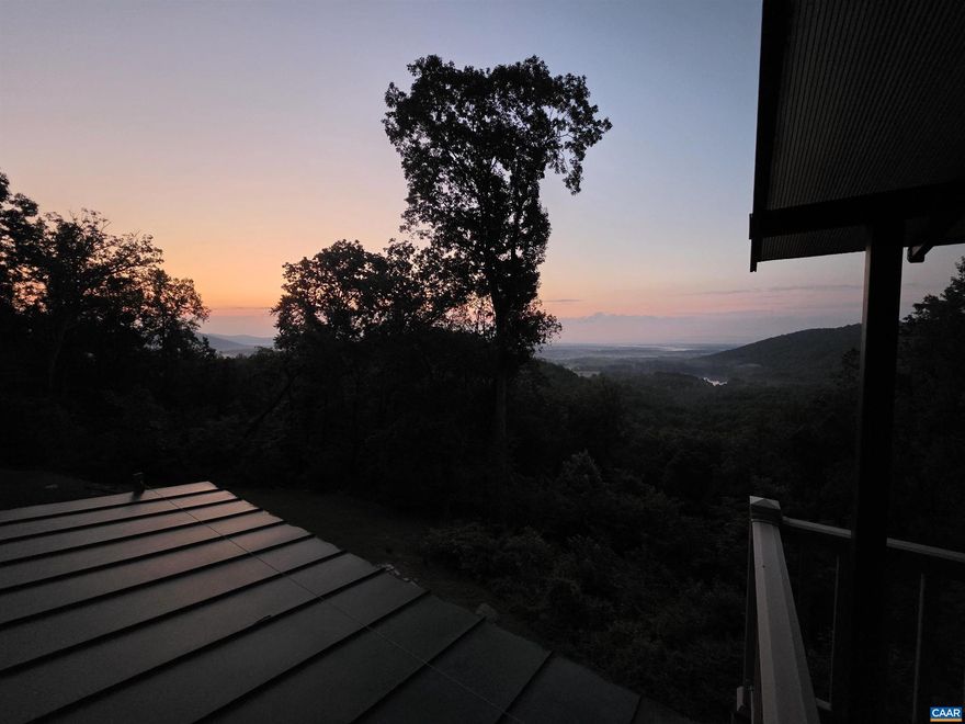 OPEN HOUSE 11/01 1-3 pm! Mountain Cabin Retreat with Sweeping Lake & Valley Views! Discover your perfect getaway on 4.44 private acres overlooking the serene waters of Greene Acres Lake. Fully renovated in 2020, this split-level cabin blends rustic charm with modern comforts including granite countertops, stainless appliances, new HVAC, Pella windows, and more. Step inside to a bright eat-in kitchen with oak cabinetry, a breakfast bar, and a cozy nook that flows into the living room with a fireplace. A spacious family room, dining area, half bath, and covered porch make the main level ideal for gathering and entertaining. Upstairs, two inviting bedrooms share a full bath, while the walkout basement offers the primary bedroom with full bath, current used a rec room. The lower level also features a laundry/utility area with a wood stove, workshop space, and a hidden storage closet. Enjoy morning coffee on the screened patio with breathtaking South River Valley views, then spend your days hiking, fishing, swimming, or kayaking with private lake access. Located just minutes from Swift Run Gap and Shenandoah National Park ? and only 2 hours from DC or 1.5 from Richmond ? this fully furnished, fiber-internet-ready home is truly turnkey.,Granite Counter,Oak Cabinets,Fireplace in Basement,Fireplace in Living Room