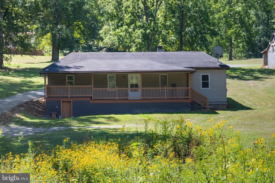 Discover the potential in this 2-bedroom, 1-bathroom home nestled on 1.6 acres of peaceful countryside. A gentle stream meanders through the front yard, creating a peaceful and picturesque setting. This property offers a quiet retreat while being only about 10 minutes west of town and less than 5 minutes from the C&O Canal, Potomac River, and the Western Maryland Rail Trail—perfect for outdoor enthusiasts.

The home is in need of some rehab work, there was a leak in the roof at the rear covered porch at one point in time and so possible mold growth on the ceiling were that occurred.  This is a great opportunity to add your personal touch and create your dream space. With its excellent location and natural surroundings, this property offers both privacy and convenience.