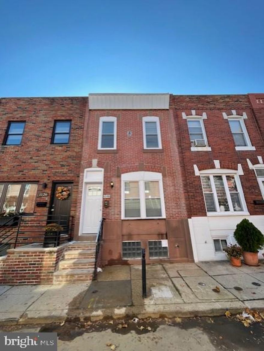 Welcome to 1128 Daly Street in Lower Moyamensing. This entire property is as green as it gets - all electric, No gas at all! All Electric appliances, electric hot water, Electric HVAC system, only one utility bill in your name! Completely remodeled with no expense spared, including all new mechanical systems. All electrical, plumbing, roofing, and brand-new Central air/heat pump system were installed here. Every room has energy efficient LED high hat lights to save on your electric bill. Every green energy efficient double paned vinyl window throughout the house is brand new. The first and second floor flooring is brand new CORE-TEC brand that is water and scratch resistant.  Brand new half bath on first floor.  The kitchen features brand new cabinets, quartz countertops, subway tiled backsplash, under mount lighting for cabinets, garbage disposal, and 4-piece stainless steel energy efficient Whirlpool appliances. Back yard is very clean and a decent sized space. The basement is in excellent condition and has a laundry area with brand new, never used, washer/dryer. The second-floor features two bedrooms with closet space in each. The bathroom is completely new as well with and elegant tiled flooring.  Ready for immediate move in.