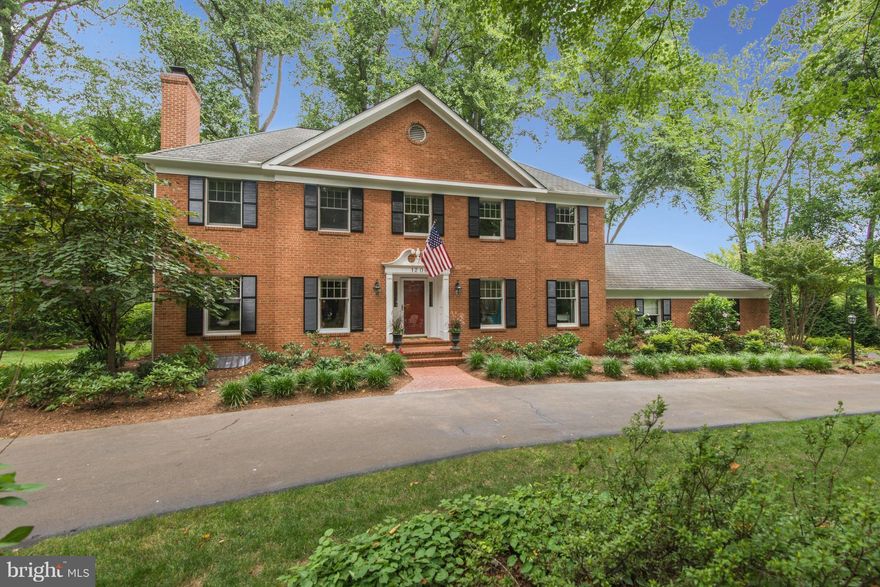 Beautiful brick colonial handsomely sited on lushly landscaped acreage with circular drive. Nature and light shines through every window of this meticulously maintained home with hardwoods on two levels & four fireplaces. The backyard offers a parklike retreat with a wisteria covered pergola & deck overlooking a trickling pond.