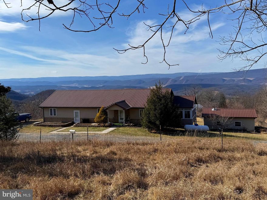 Extraordinary 122+/- acre off-grid retreat offering privacy, self-sufficiency, and breathtaking long-range mountain VIEWS with unforgettable sunsets. Designed for full-time off-grid living, this unique property features a thoughtfully designed 3-bedroom home including a primary suite, 3 full bathrooms, a bright sun room and two fully equipped kitchens, one with a commercial gas stove, ideal for multi-generational living, guests, or flexible use.  Home has masonry exterior walls.



Energy independence is front and center with a robust solar power system supported by lithium iron phosphate battery storage, complemented by backup generator systems with choice of propane or diesel.  Additional features include a well,  a propane on-demand hot water heater for floor heat & hot water, ensuring comfort and efficiency year-round.  



The land itself is a homesteader’s dream, featuring a balanced mix of open pasture and wooded acreage, fruit trees, established asparagus plantings, and multiple agricultural structures including three high-tunnel greenhouses, a small starter greenhouse, utility sheds, and a small barn. Explore the property further to find a spring, a small cave and an abundance of wildlife.  UTV Roads throughout the property.  A newly completed survey with clearly marked boundaries adds confidence and value.



An attached two-car garage, sweeping VIEWS in every direction, and unmatched peace and privacy complete this remarkable offering. Ideal for homesteading, sustainable living, or a private retreat where independence and natural beauty converge.  Located off a County Maintained Road for All Season Access.



Owners request NO DRIVE-BYS. Showings by appointment only.  Click on the camera icon for your personal virtual tour of the house and call today to schedule a showing.