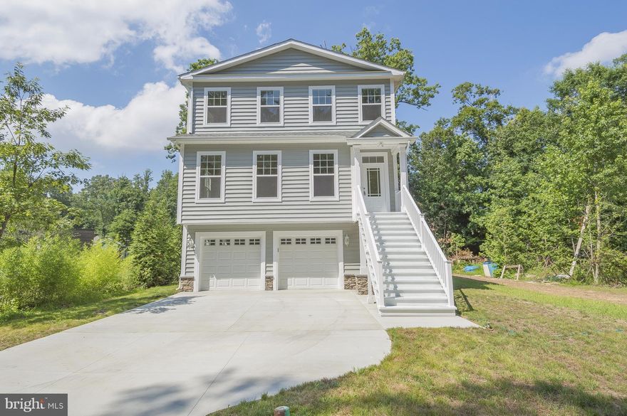 New Home ready to move in immediately!!  4 Bedrooms, 3 1/2 baths, 3 levels, large family room and center island in kitchen. Granite counters and SS appliances. Hardwood floors throughout! Separate dining room. Large MB with HUGE walk-in closet.  Master bath w/ soaking tub. 2 car garage!  Water View and short walk to the Chesapeake Bay. Energy Efficient Home!