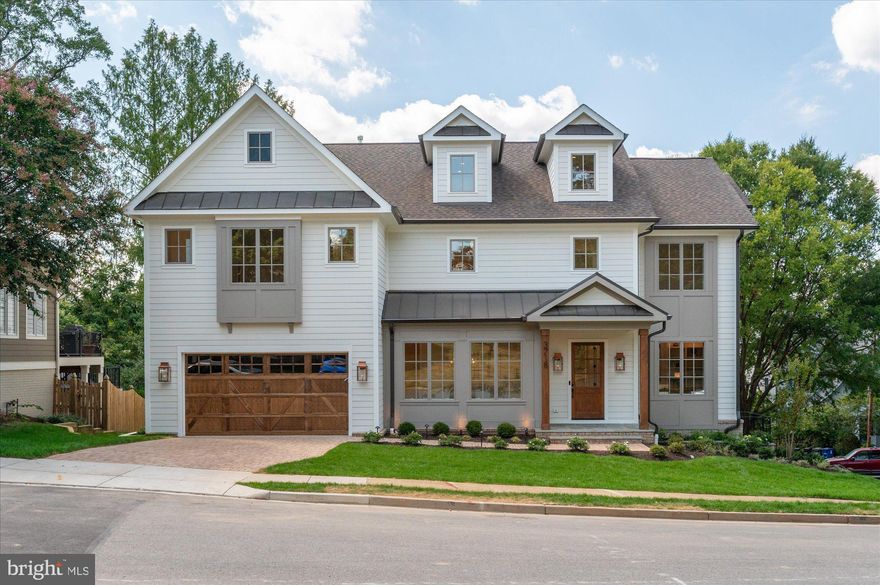 Finished and ready to move in! M-R Custom Homes presents this beautiful new custom home on a quiet street in Country Club Hills. This home has all of the bells and whistles - featuring 7 bedrooms, 7 full bathrooms, and two powder rooms with 7,059 square feet of finished living space over four levels and beautiful seven-inch white oak hardwood floors throughout the main and upper levels. The main level includes 10ft ceilings, and a beautiful gourmet kitchen with custom inset maple cabinetry, 2.5" quartz countertops, 48" paneled Subzero refrigerator, 48" Wolf gas range, two paneled Bosch dishwashers, and a built-in Wolf microwave. The kitchen opens to spacious great room with exposed beams and a wood burning fireplace with stone surround and wood mantle. Through the butler's pantry is an elegant formal dining room with abundant natural light. A large grilling deck and screened porch with skylights, heaters, and speakers provides an amazing outdoor living space overlooking the backyard. A private study with built-ins, en-suite bedroom, casual family dining area, a mud room with built-ins, and an attached two-car garage complete the main level living spaces. The upper level is highlighted by a luxurious primary suite with dual walk-in closets with built-ins, and a spa-like bathroom with heated floors, double vanities, stand-alone soaking tub, and heavy glass enclosed shower with mounted handheld and rain shower head. The 3rd floor loft offers an additional bedroom with full bathroom. The walk-out lower level includes a spacious recreation room with a gas fireplace with tile surround and a  a full-sized wet bar with island, dual wine refrigerator columns, dishwasher, microwave, and an ice maker. An exercise room with rubber flooring, a play room, an en-suite bedroom, a separate powder room, and a finished storage area round out the lower level living spaces. The basement walks out to a spacious back yard paver patio with wood burning fireplace. This home also has a built-in elevator shaft for future conversion. The 10,476 square foot lot is professionally landscaped with outdoor lighting and includes an irrigation system. Convenient to Glebe Park, Madison Community Center, Washington Golf, Chesterbrook Shopping Center, and much more. Jamestown ES/ Williamsburg MS/ Yorktown HS.