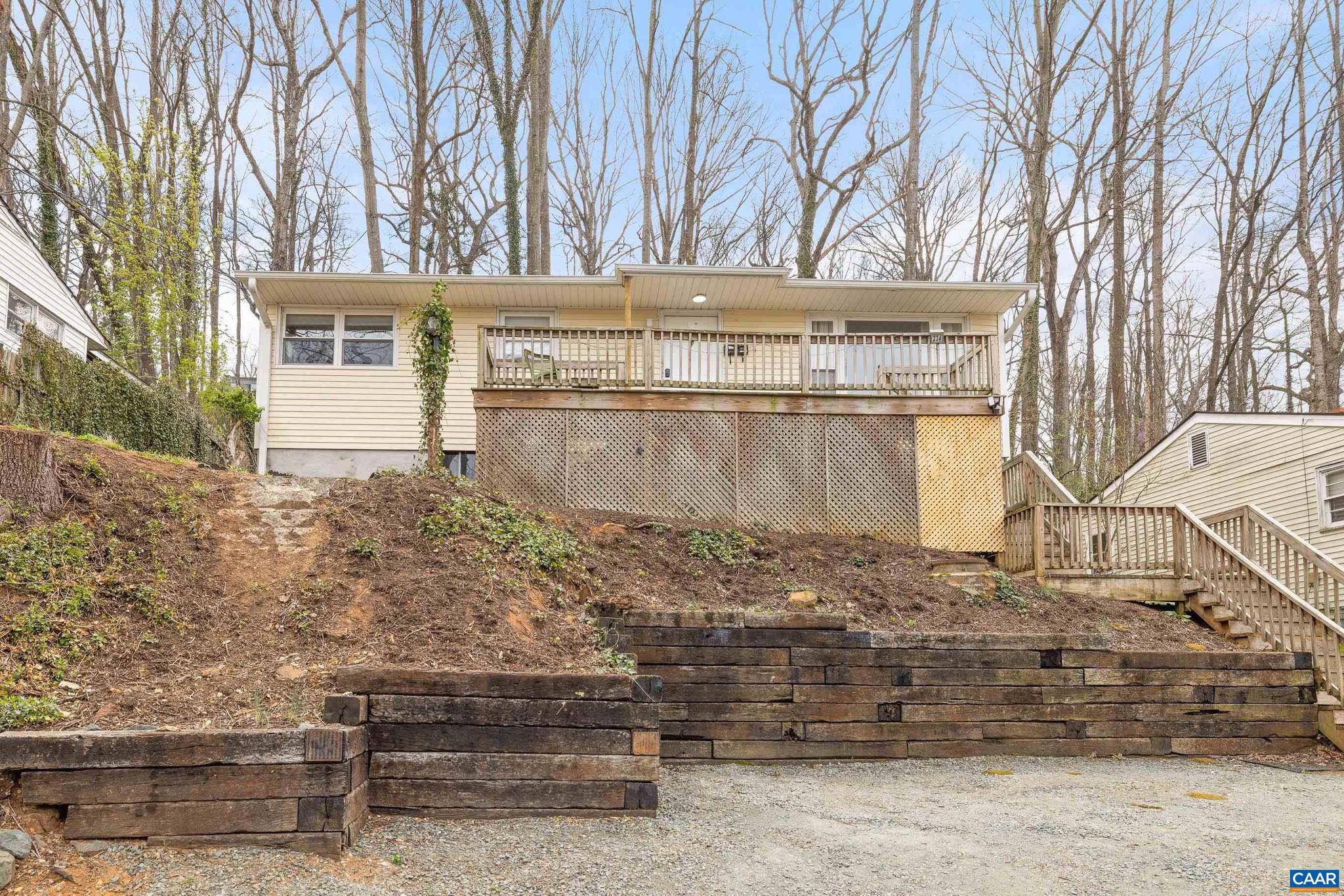 CHARMING, UPDATED HOME JUST MINUTES FROM UVA!! GORGEOUS CITY VIEWS! SELLER IS WILLING TO SELL FURNTIURE! Welcome to this beautifully updated, totally move-in ready home featuring solid hardwood floors thru-out?no carpet! Step into a freshly painted interior with newer recessed lighting thru-out every room. The spacious dining room is filled with natural light from a large picture window, creating the perfect setting for family meals or entertaining. Kitchen is a true standout, boasting modern updates including newer cabinets, sleek stone counters, stainless steel appliances, and durable ceramic tile flooring. The bathroom has also been tastefully updated with a brand-new vanity & commode. Outside, enjoy morning coffee on the large front porch or host gatherings on the generous back deck. Need more space? The unfinished basement offers nearly 1,000 additional square feet?ideal for a home gym, studio, or future finished living area. All of this in an excellent location, just minutes from UVA, shopping, dining, and more. Don?t miss this rare opportunity to own a stylish, turnkey home in a prime spot! Property has been an excellent short term rental property for traveling nurses! A MUST SEE! Cable TV/internet and Ting Fiber internet!!,Maple Cabinets